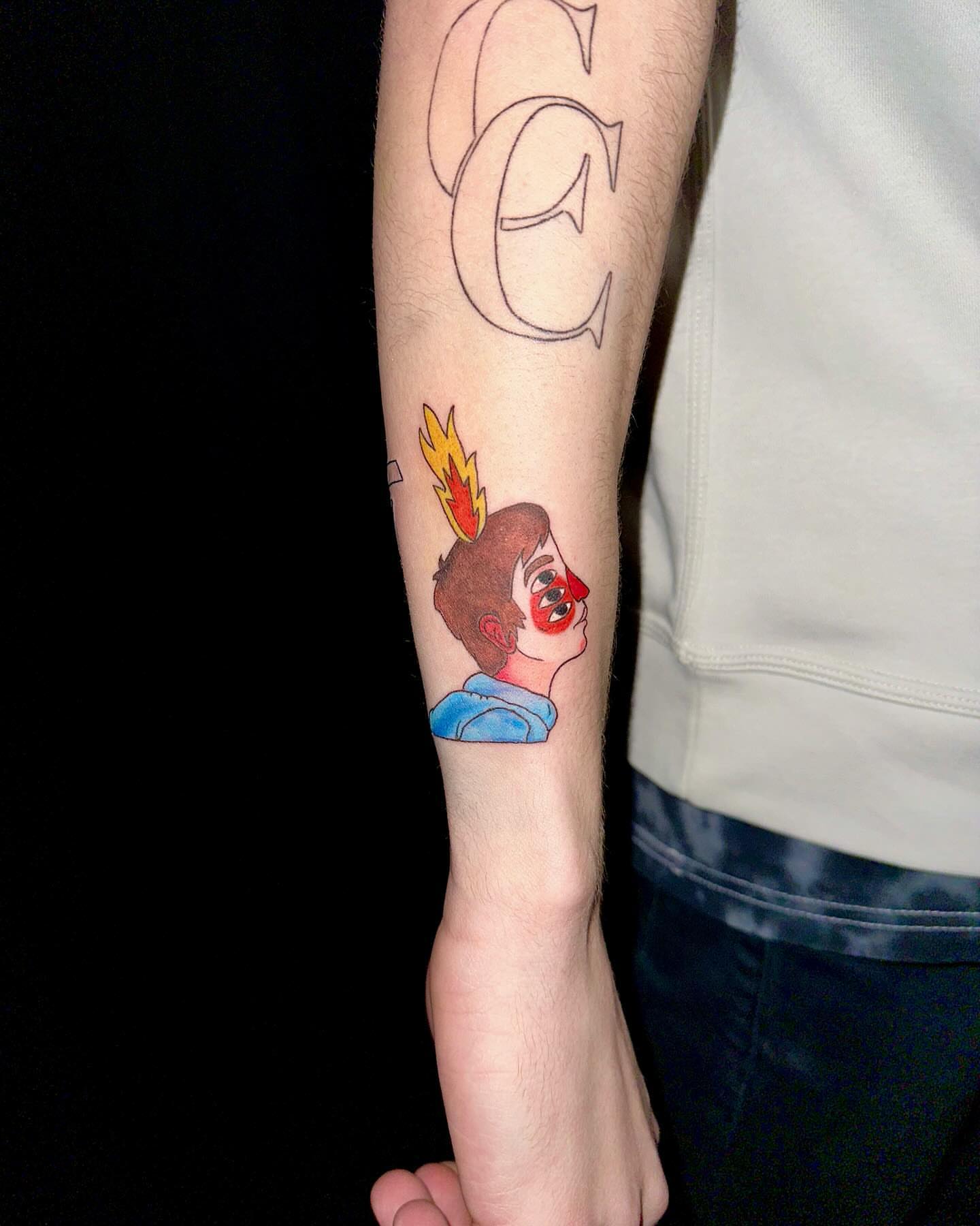 Flame-haired character anime tattoo on the forearm by Marie Novotny, Lakewood, Ohio