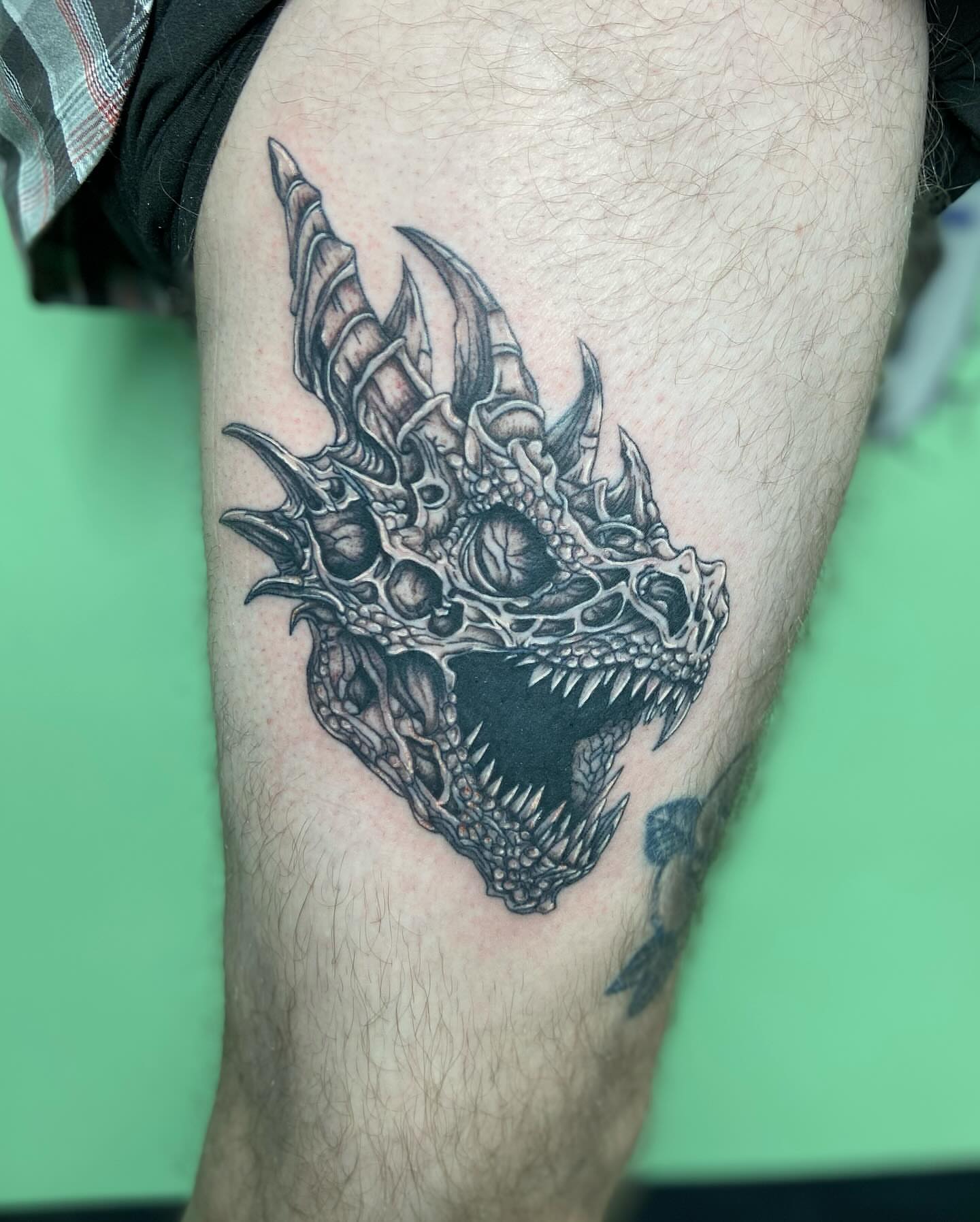 Dragon skull realism tattoo on the thigh by ✶ teryn ✶, Akron, Ohio