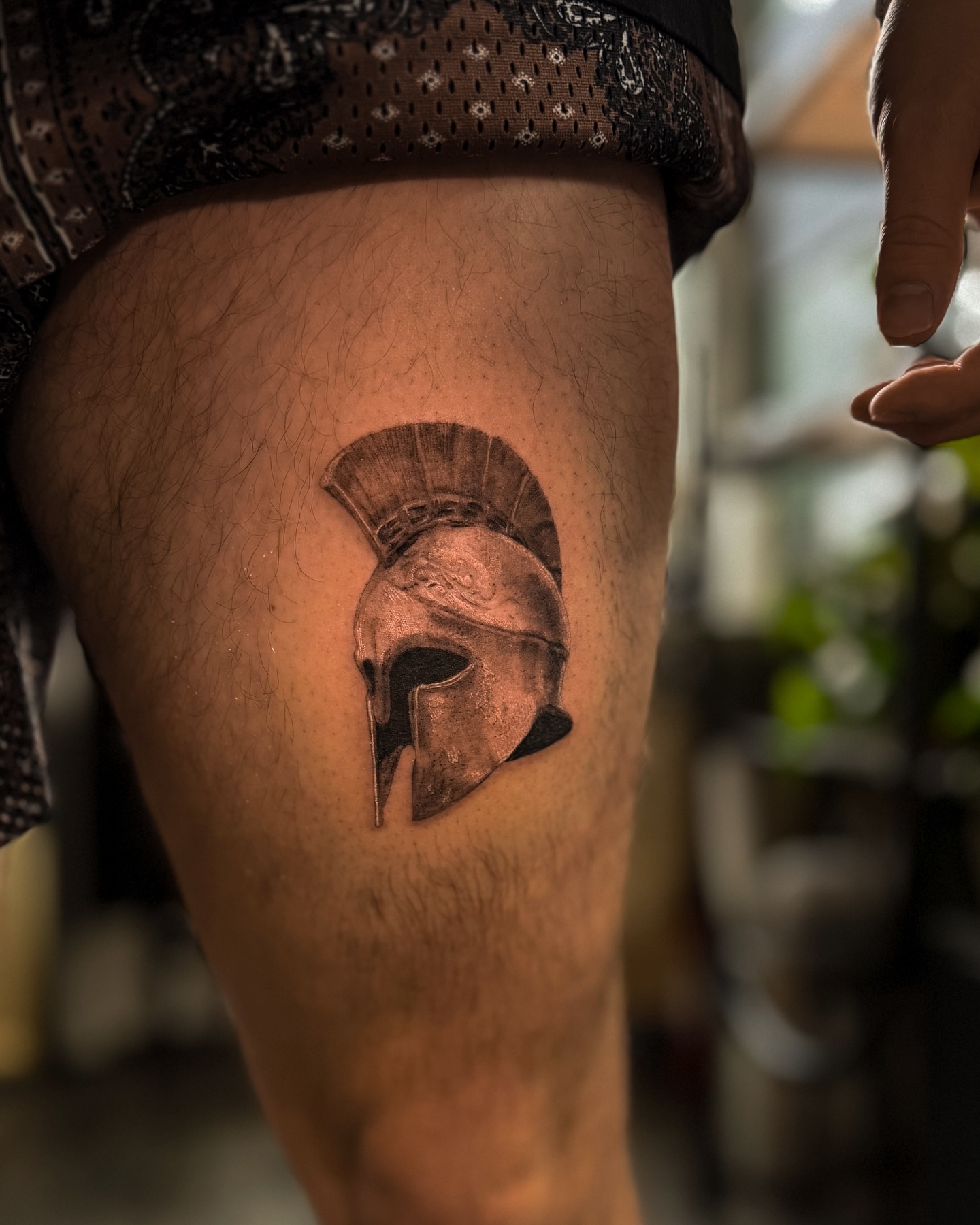 Spartan helmet realism tattoo on the thigh by Rose