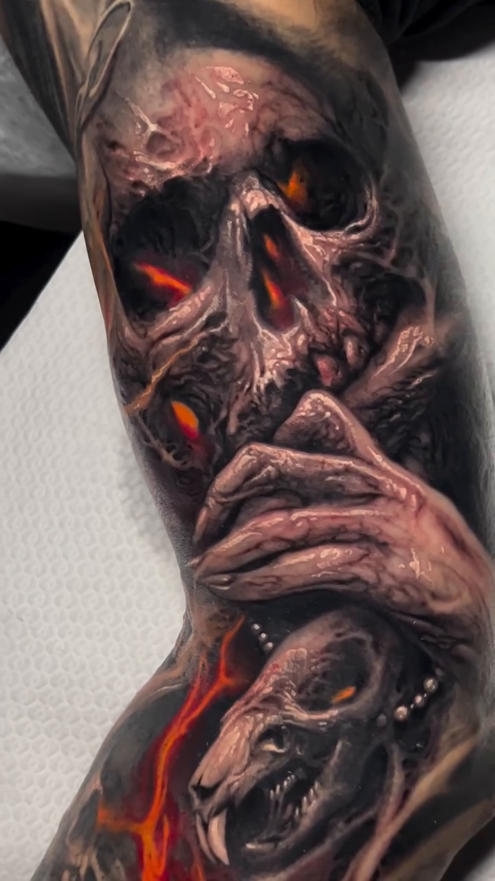 Skull and bones with fire dark realism tattoo by David Jorquera