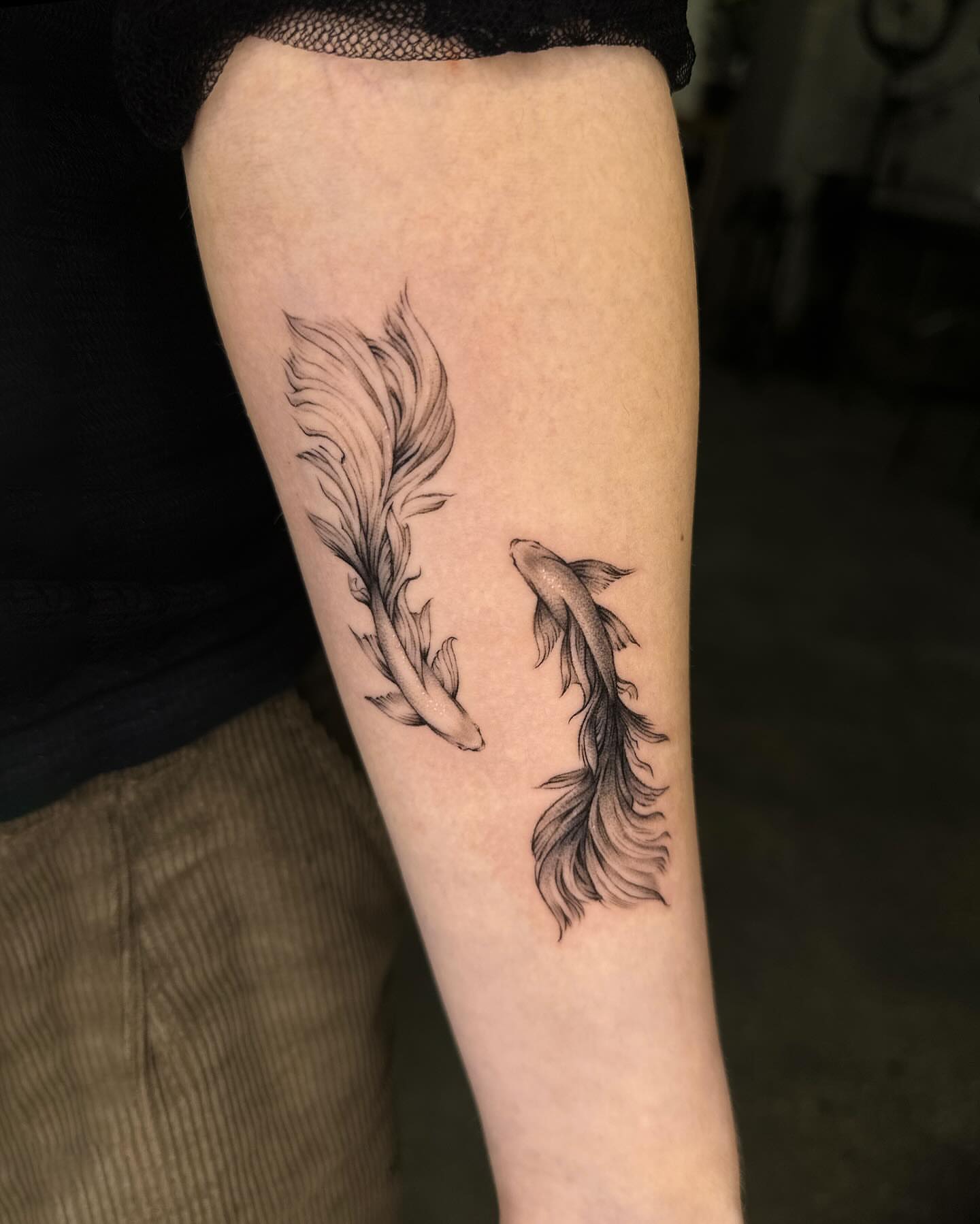 Koi fish black and grey tattoo on the forearm by Tattoo artist EJ (Mireu)