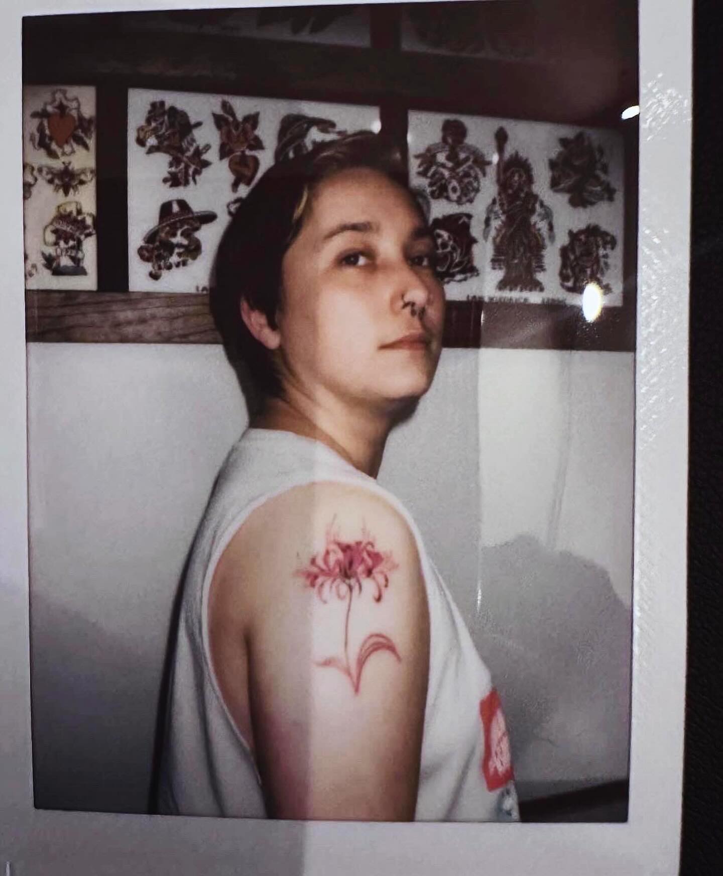 Flower dotwork tattoo on the shoulder by Bennie Bae