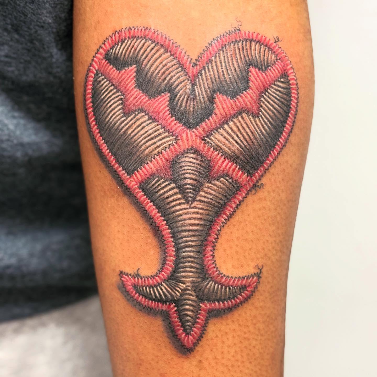 Heart geometric tattoo on the forearm by Lacee-Beth Finch