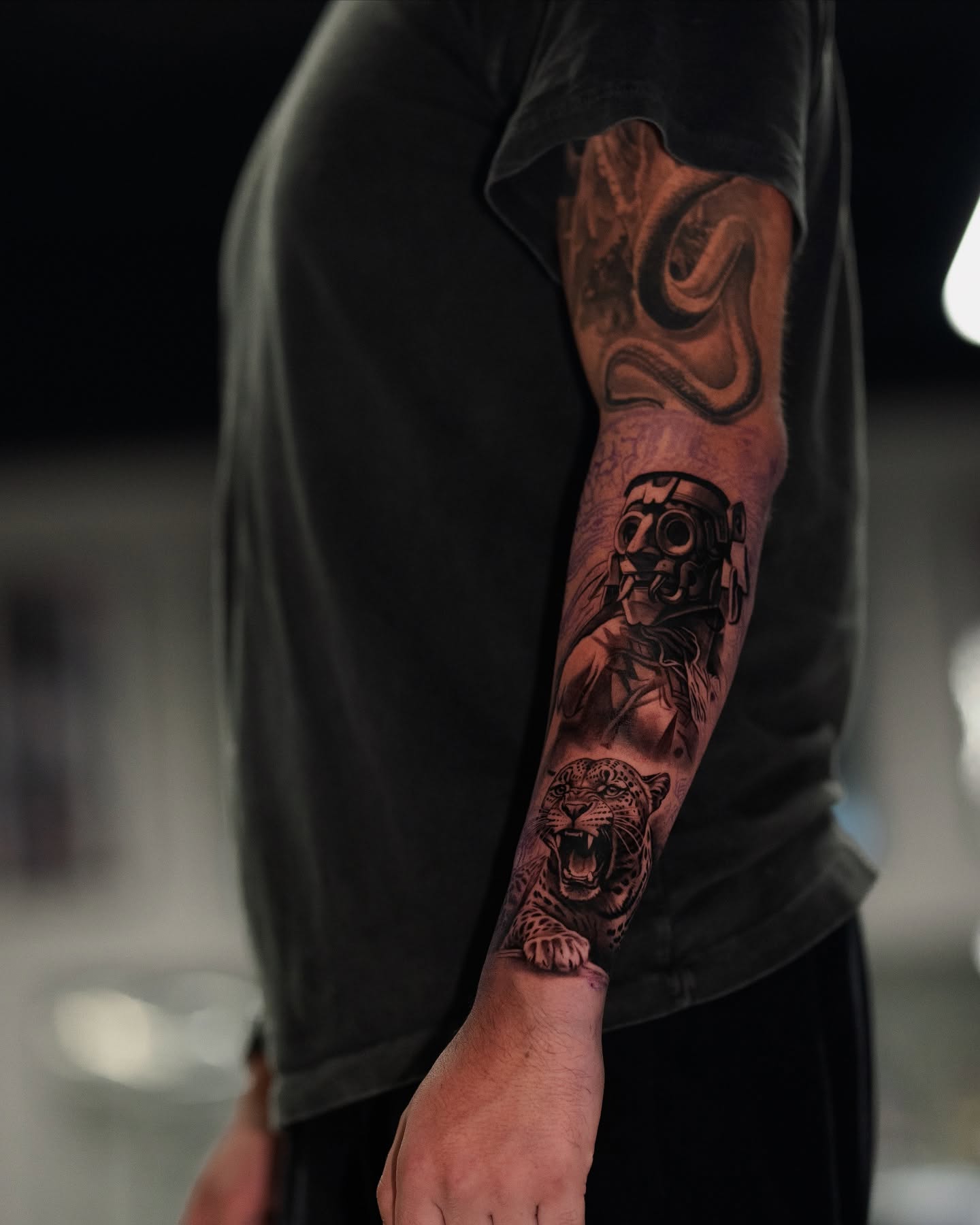 Woman with gas mask and tiger realism tattoo on the forearm by Joey Hella Tattoo Artist