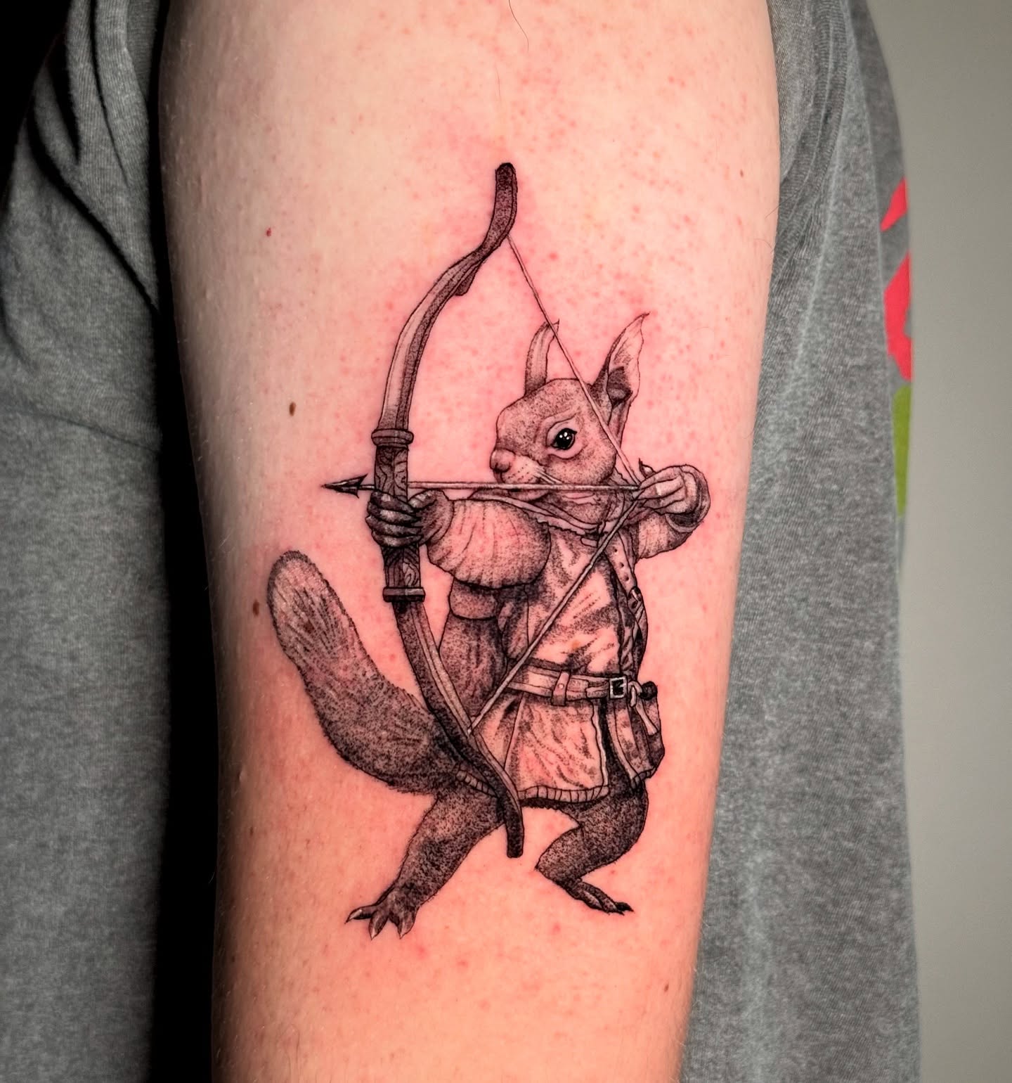 Squirrel archer dotwork tattoo on the forearm by Brisia Cisneros
