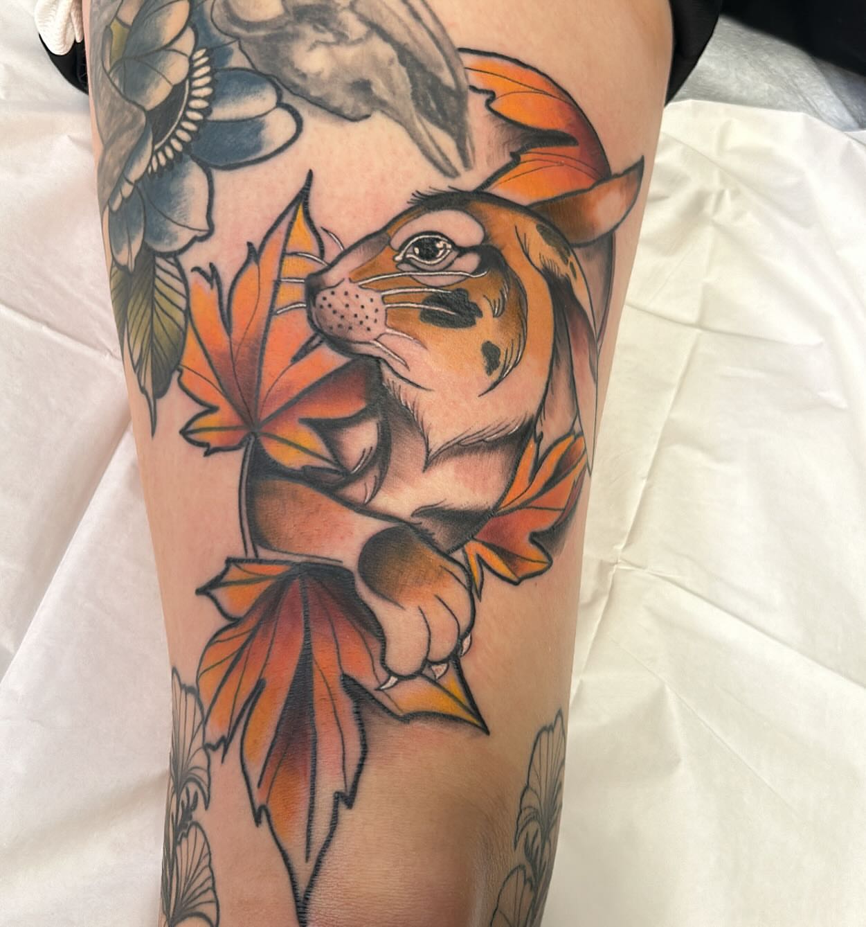 Autumn leaves and tiger American traditional tattoo on the forearm by Edward A. Boesch