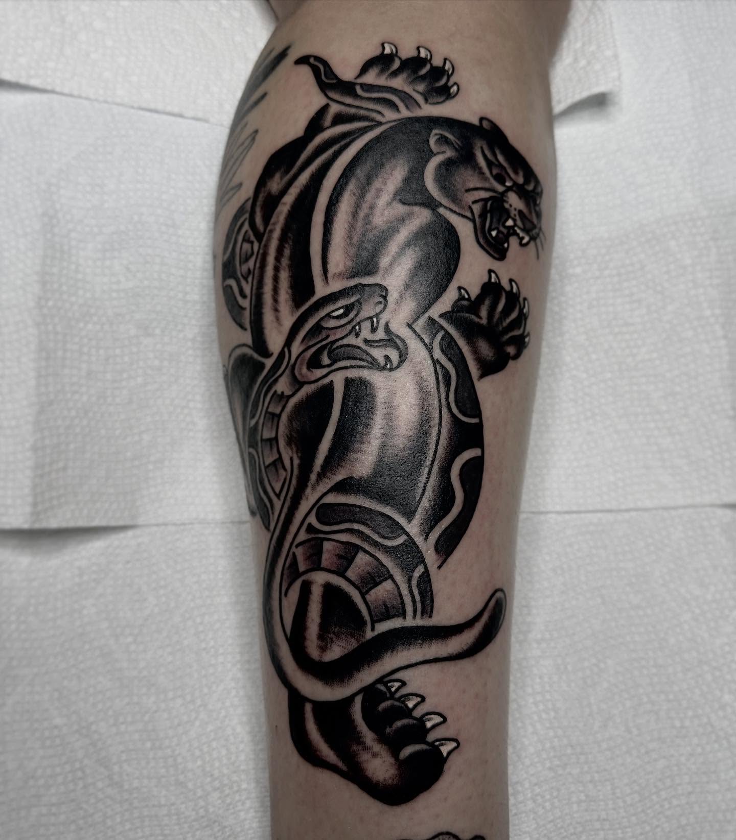 Panther and snake American traditional tattoo on the forearm by Elijah Edwards