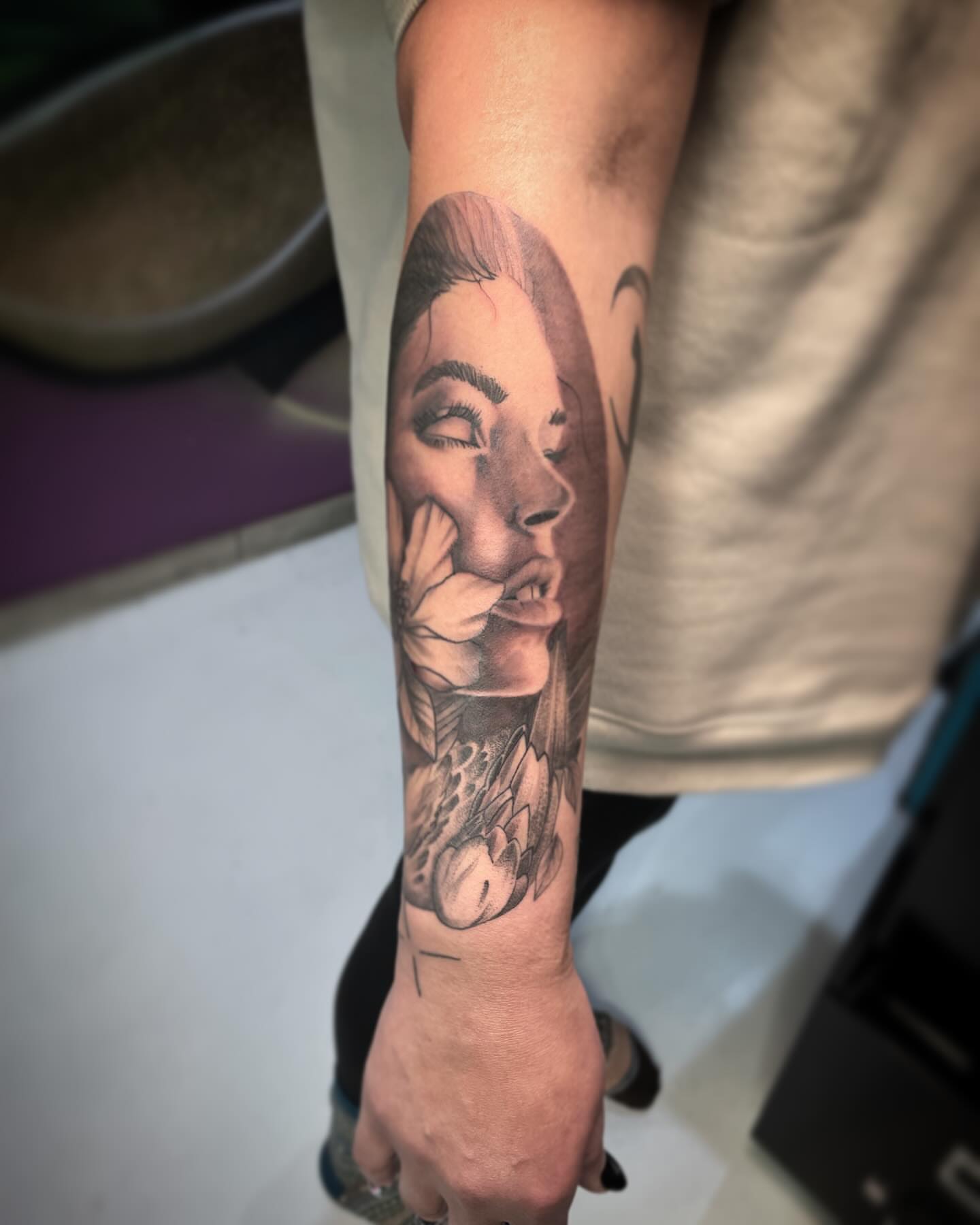 Woman realism tattoo on the forearm by Terence Taylor