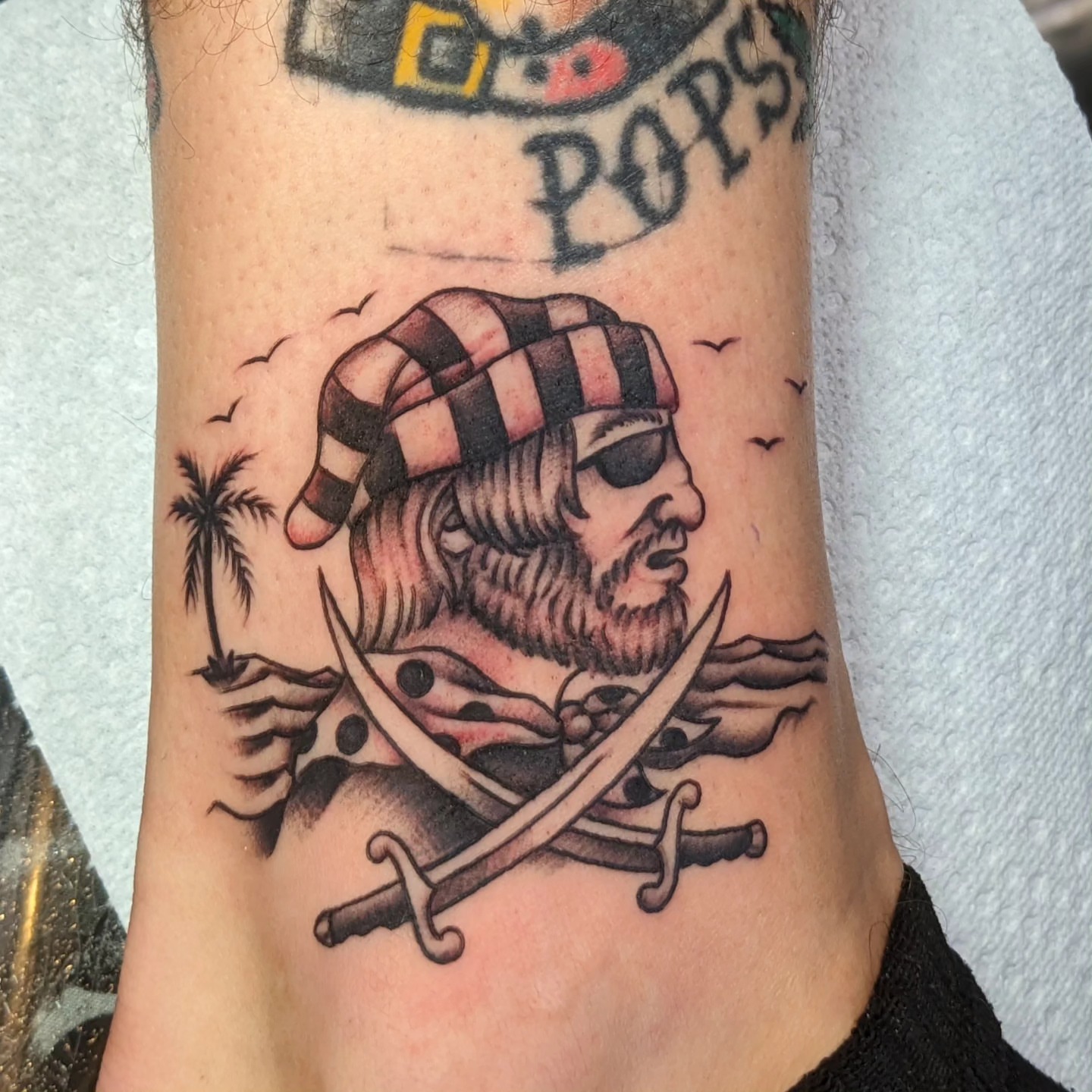 Pirate American traditional tattoo on the forearm by Matt Simmonds