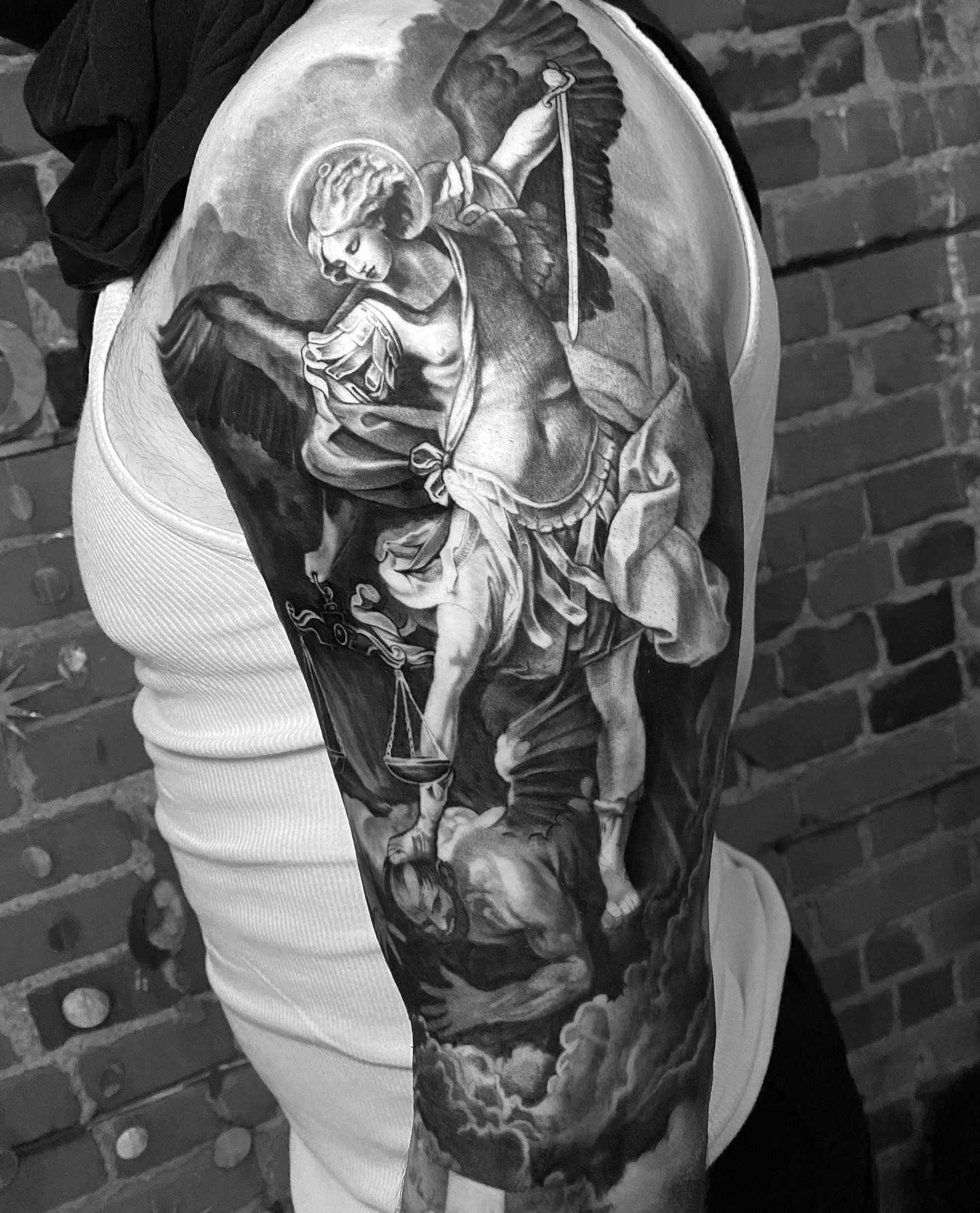 Angel with scales realism tattoo on the upper arm by Francis Hagendorn, Toronto, Ontario