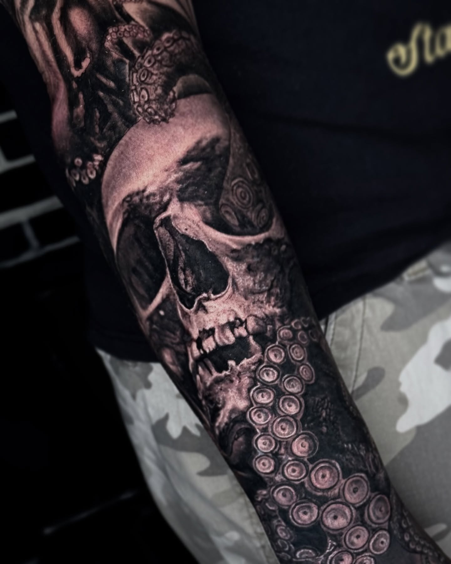 Skull and octopus realism tattoo on the forearm by Maverick Mayes🕷