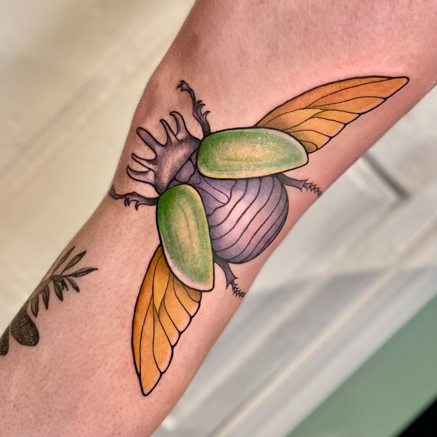 Scarab beetle realism tattoo on the forearm by Liv