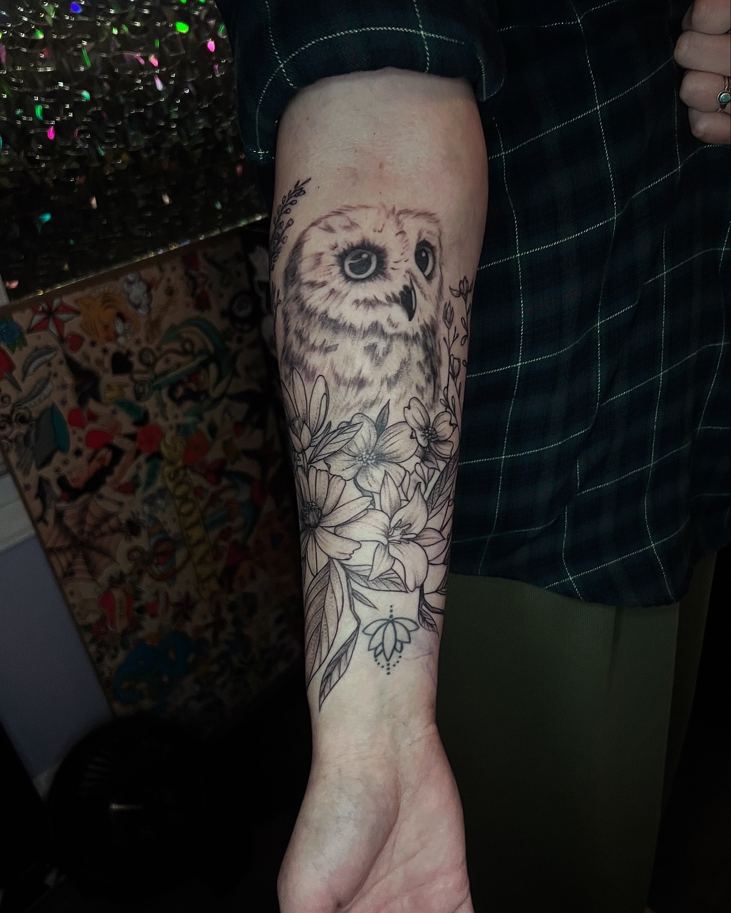 Owl and floral realism tattoo on the forearm by Rose DeLisse