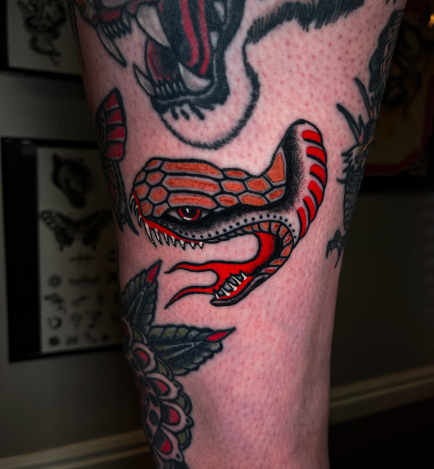 Snake American traditional tattoo on the forearm by Miguel Henrik