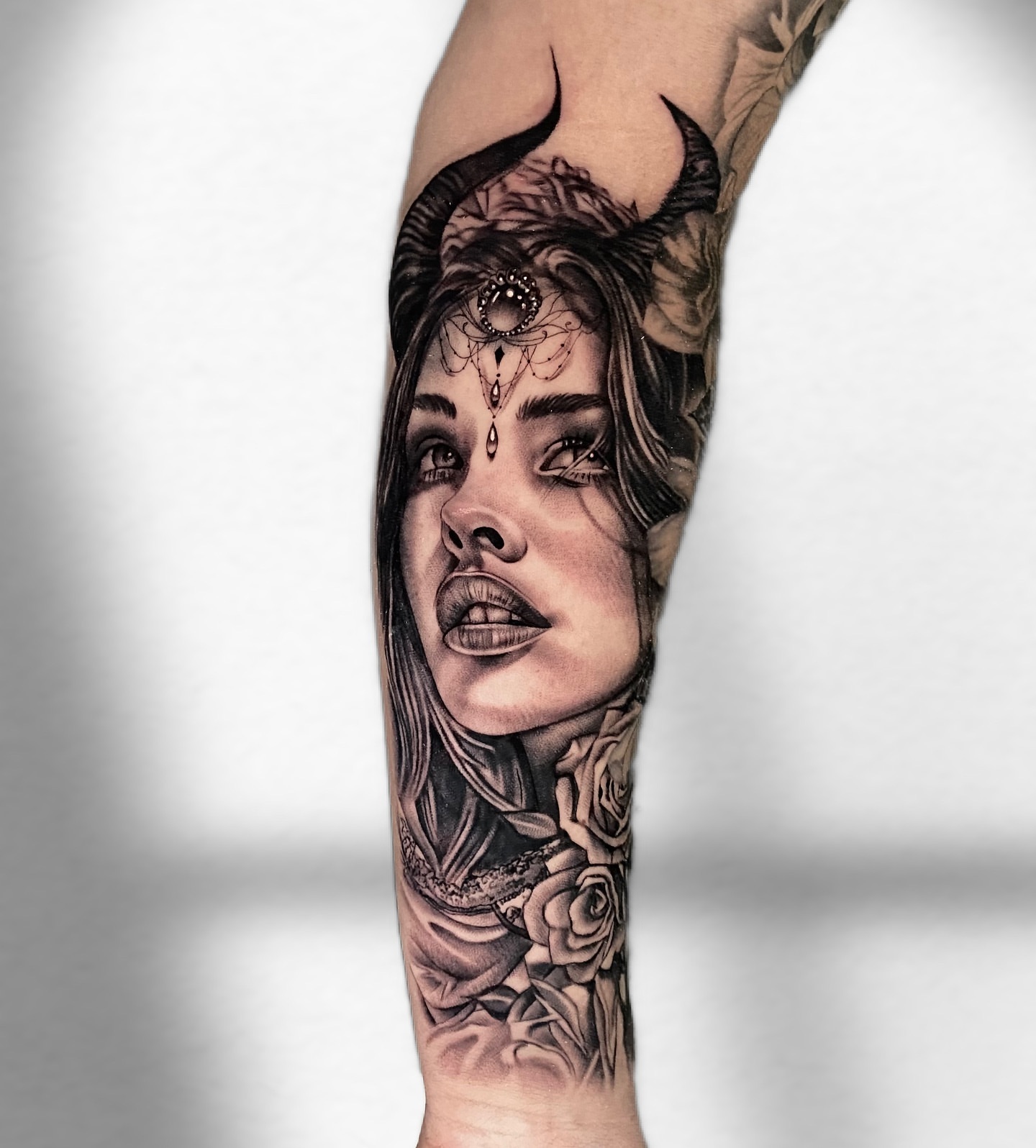 Woman's face realism tattoo on the forearm by Becky Lee Cameron