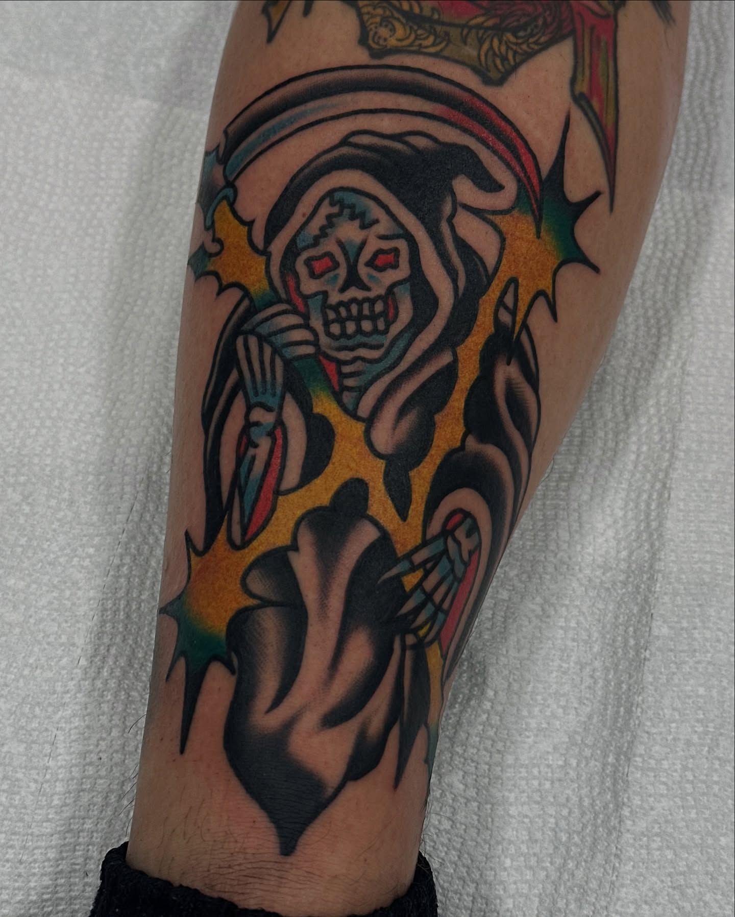 Grim reaper American traditional tattoo on the forearm by Steve Pearson