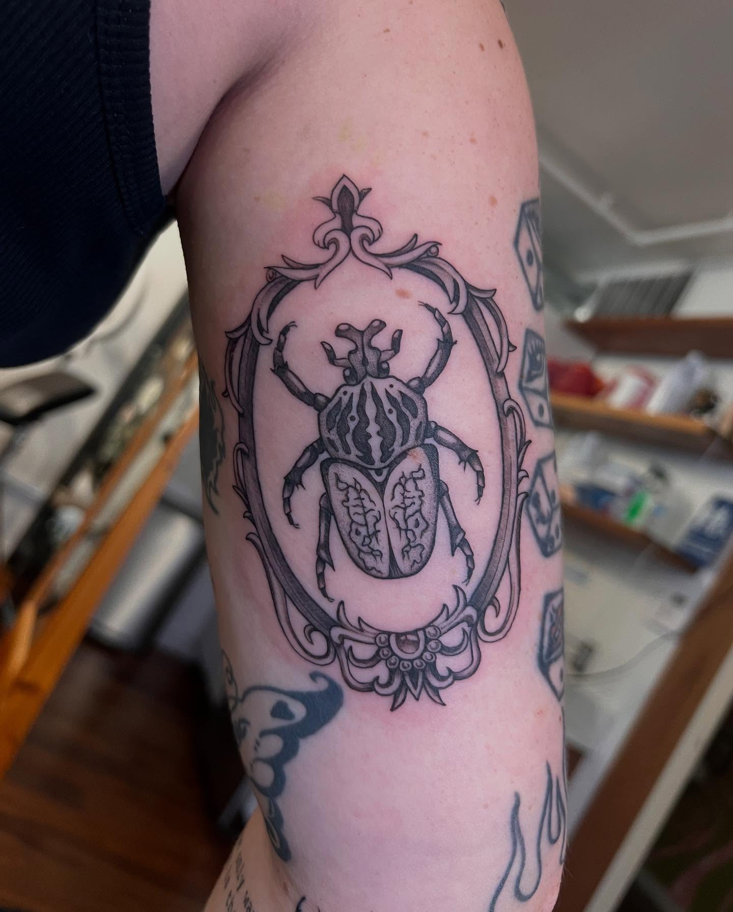 Scarab beetle black and grey tattoo on the forearm by Tasha Venola, Bellingham, Washington