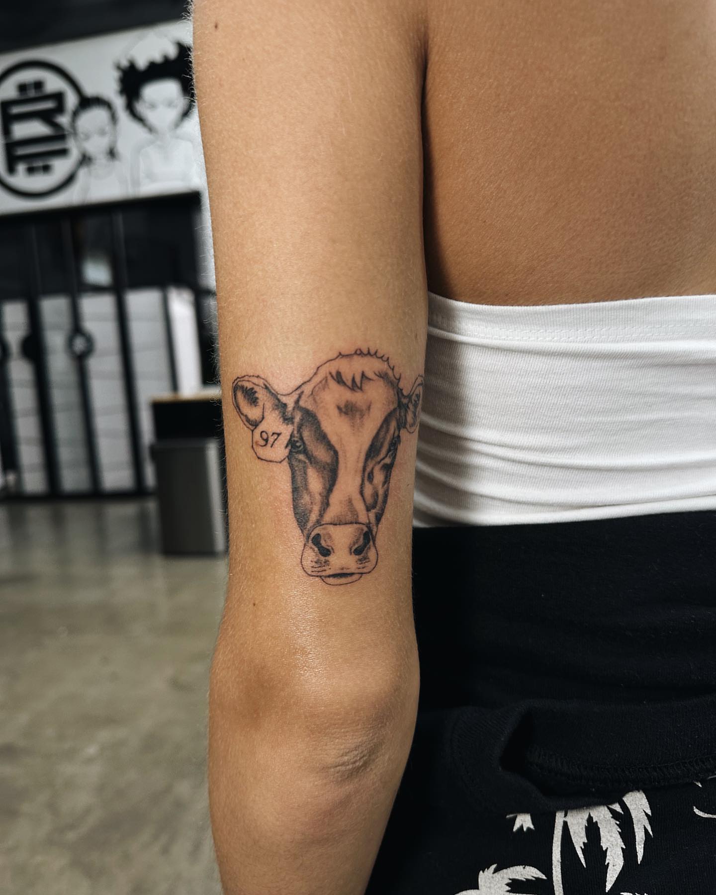 Cow head realism tattoo on the forearm by viktoria raquel