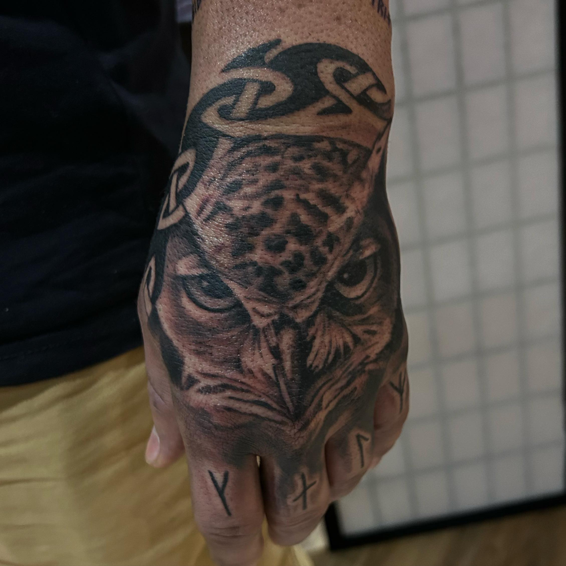 Owl realism tattoo on the hand by Cody Lambert