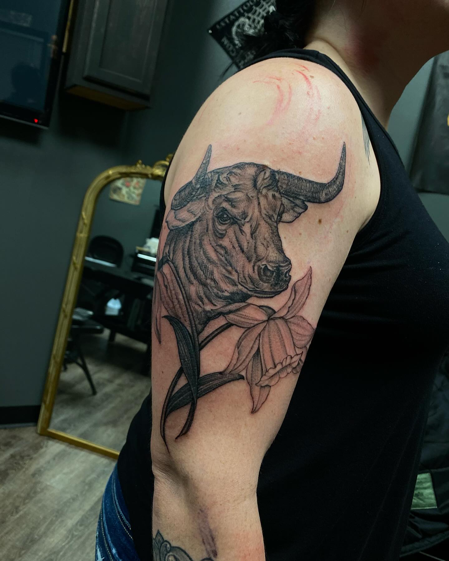 Bull and lotus realism tattoo on the shoulder by Chase Skylar Clayton Ogle