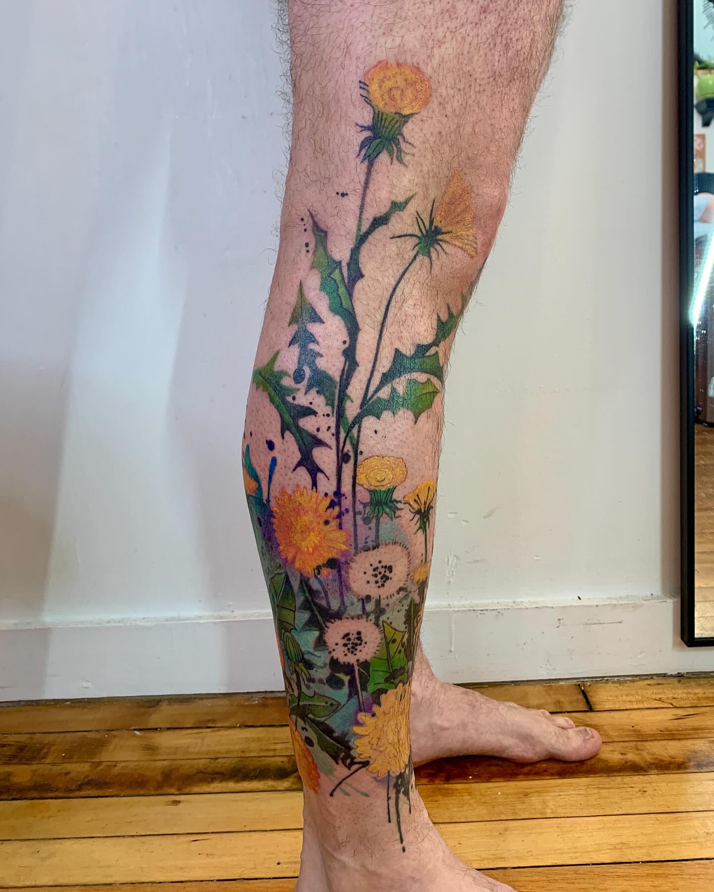 Wildflowers dotwork tattoo on the calf by Gene Coffey, New York, New York