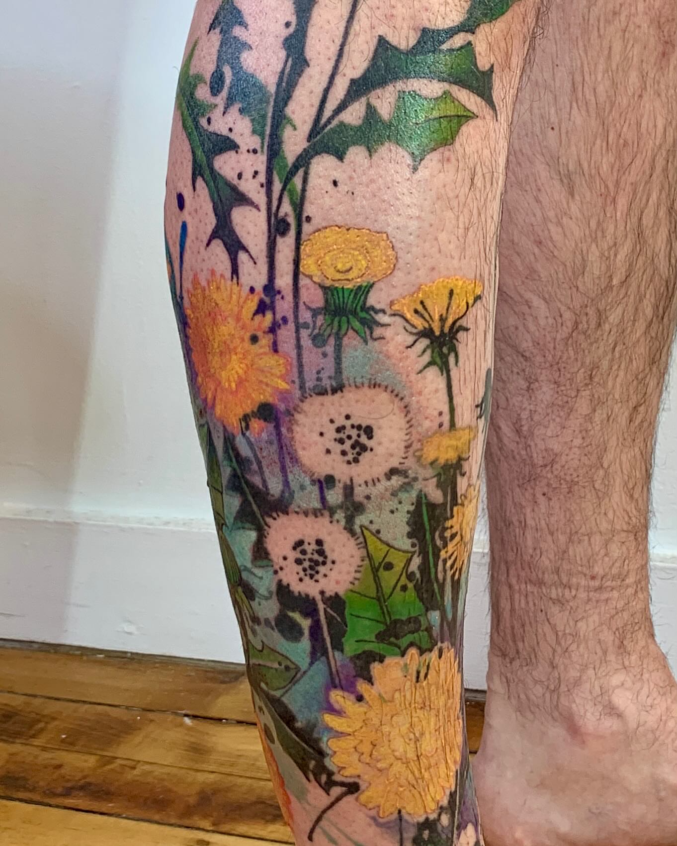 Wildflowers dotwork tattoo on the calf by Gene Coffey, New York, New York