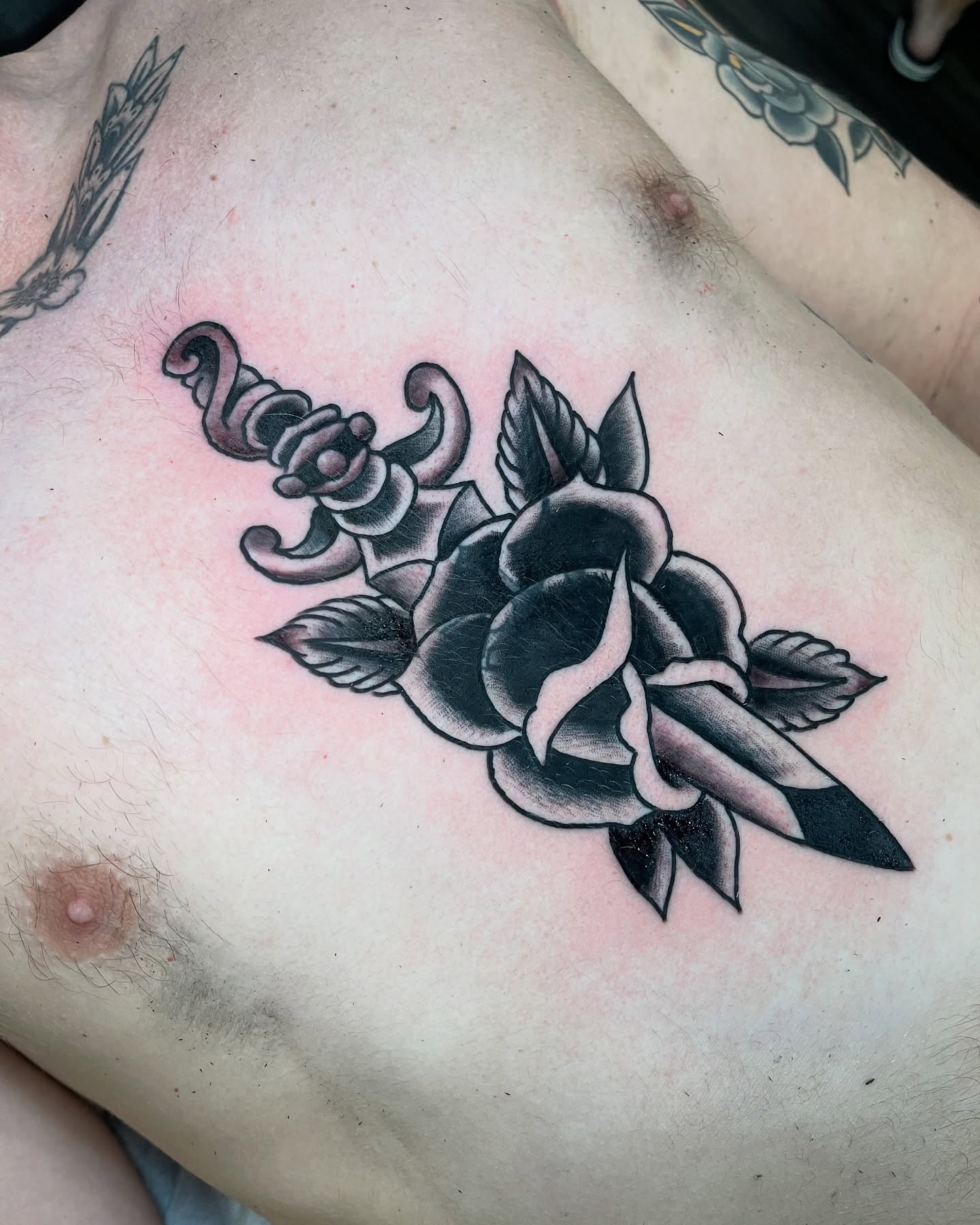 Rose and dagger American traditional tattoo on the chest by adamsayre, San Diego, California