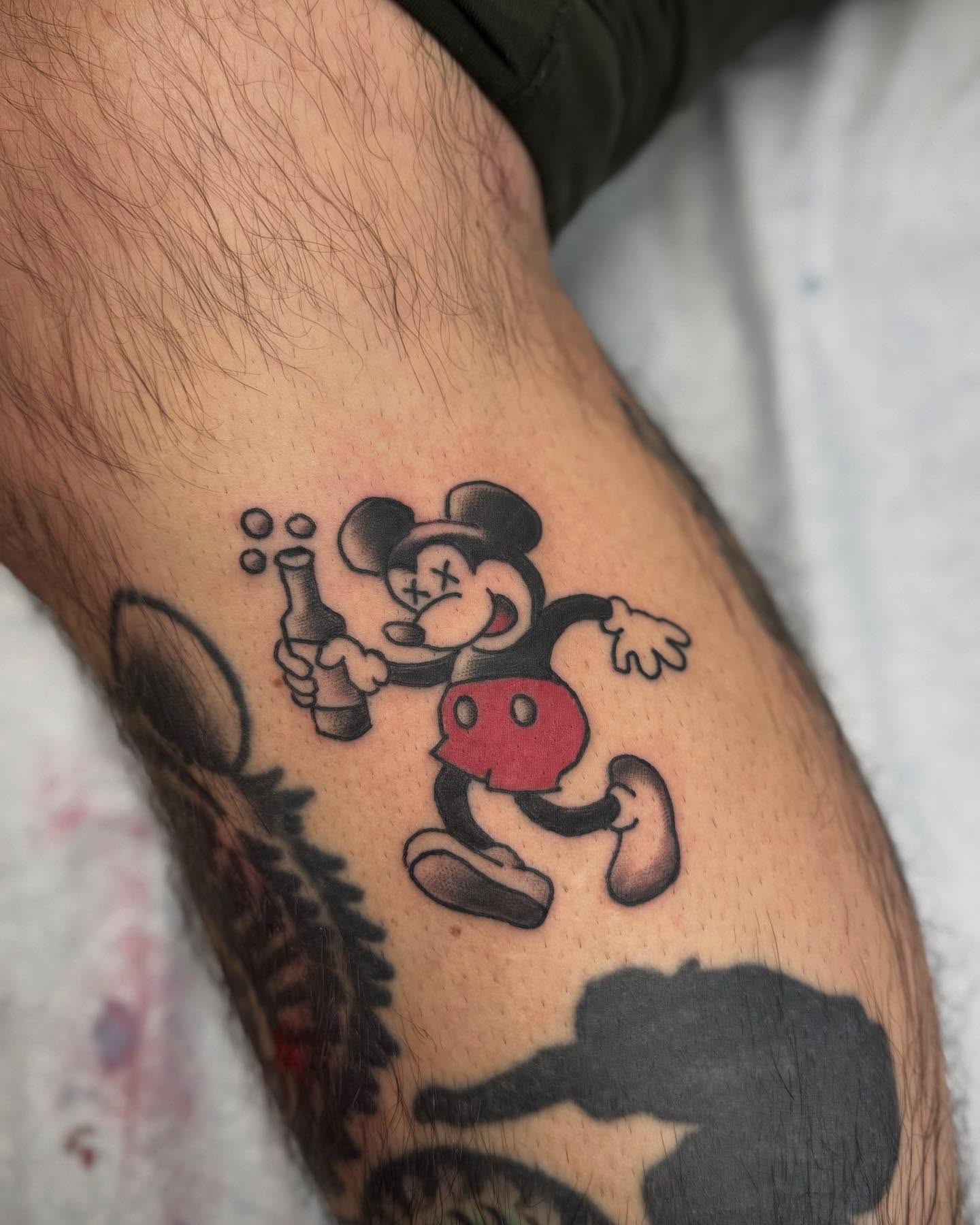 Drunk mickey mouse American traditional tattoo on the forearm by Micah Norman, San Francisco, California