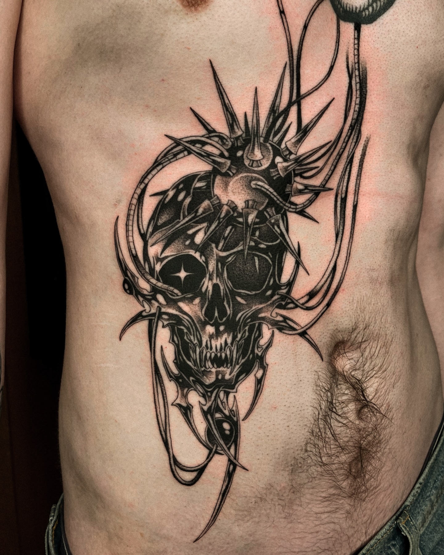 Skull dark realism tattoo on the ribs by David Ha