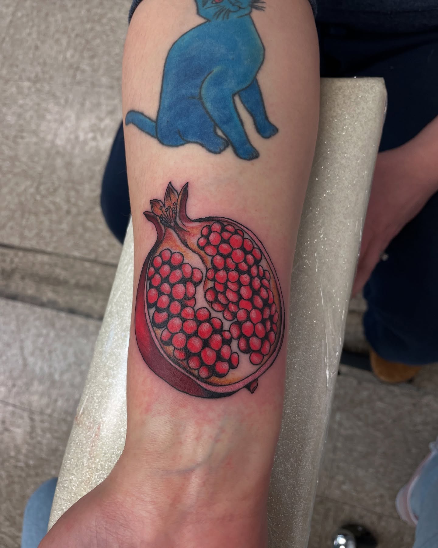 Pomegranate realism tattoo on the forearm by Dayton Tattoo Artist, Miamisburg, Ohio