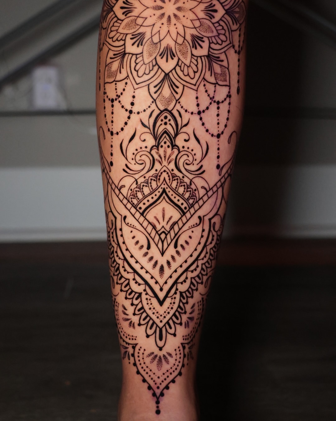 Mandala dotwork tattoo on the calf by Jesus Bravo