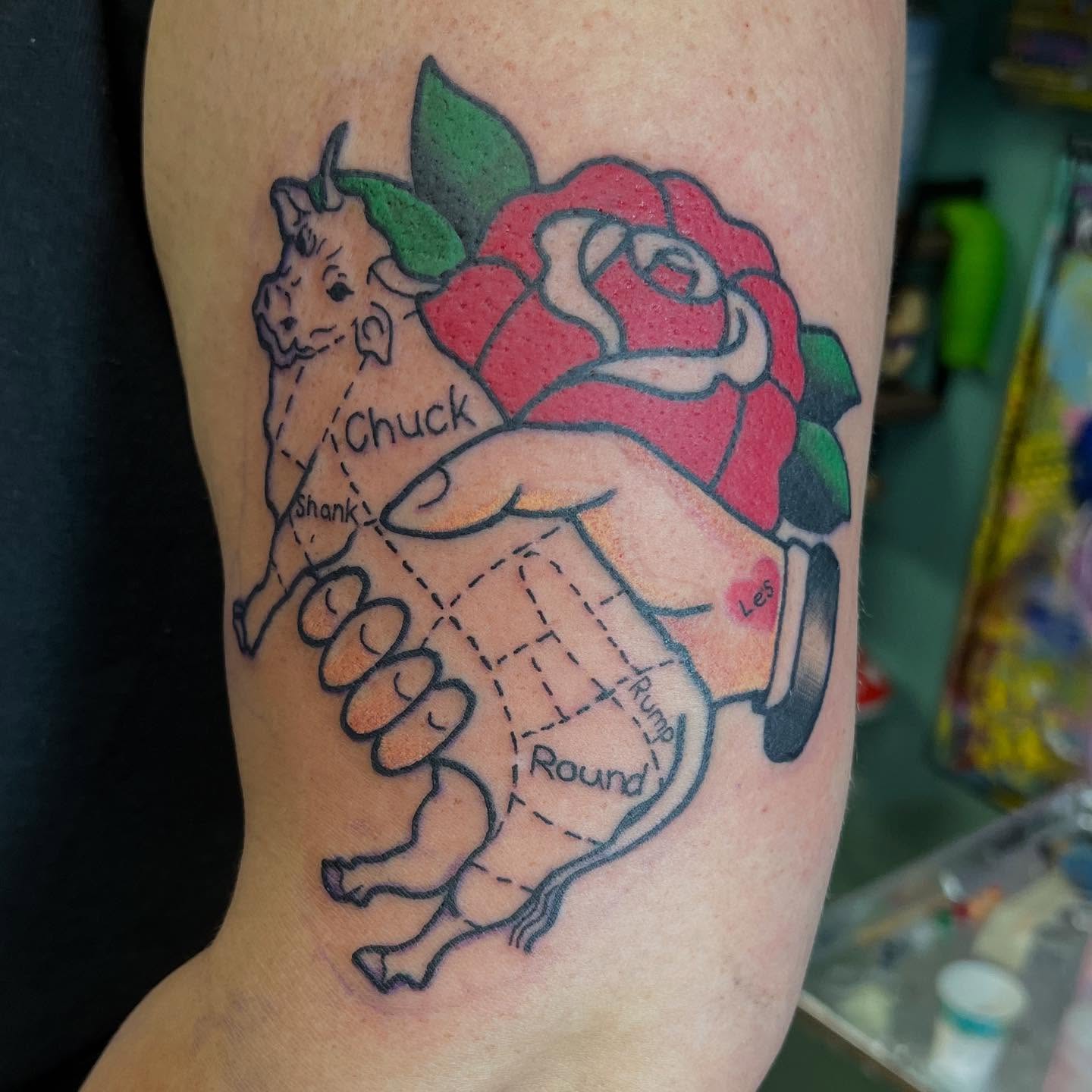 Rhino and rose American traditional tattoo on the forearm by Katie Sayre