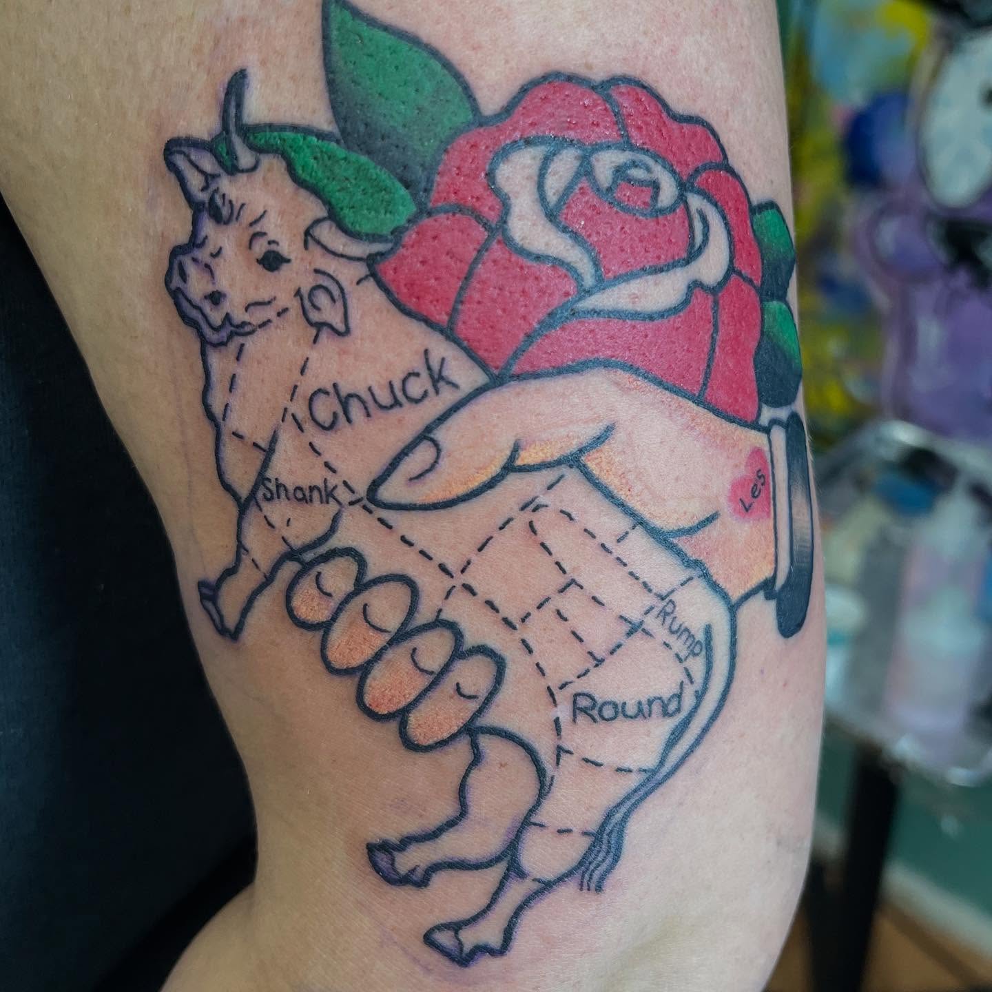 Pig and rose American traditional tattoo on the forearm by Katie Sayre