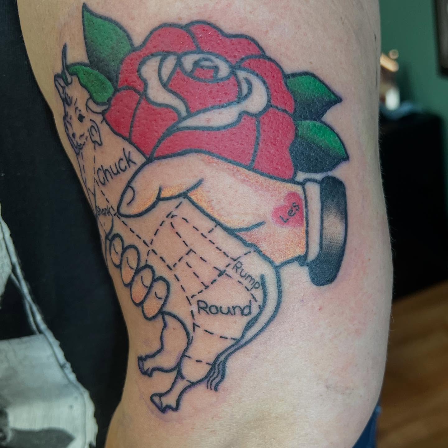 Rose and handshake American traditional tattoo on the forearm by Katie Sayre