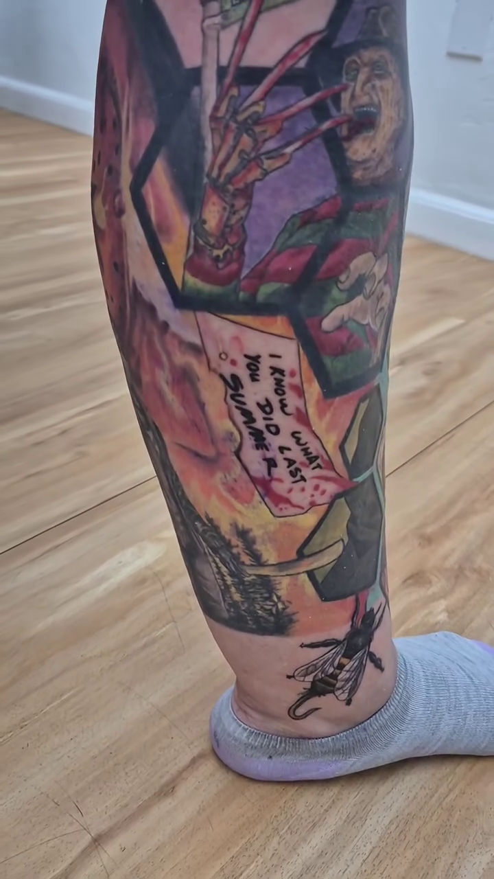 Skeleton hand holding a sign trash polka tattoo by Chris TL Jones
