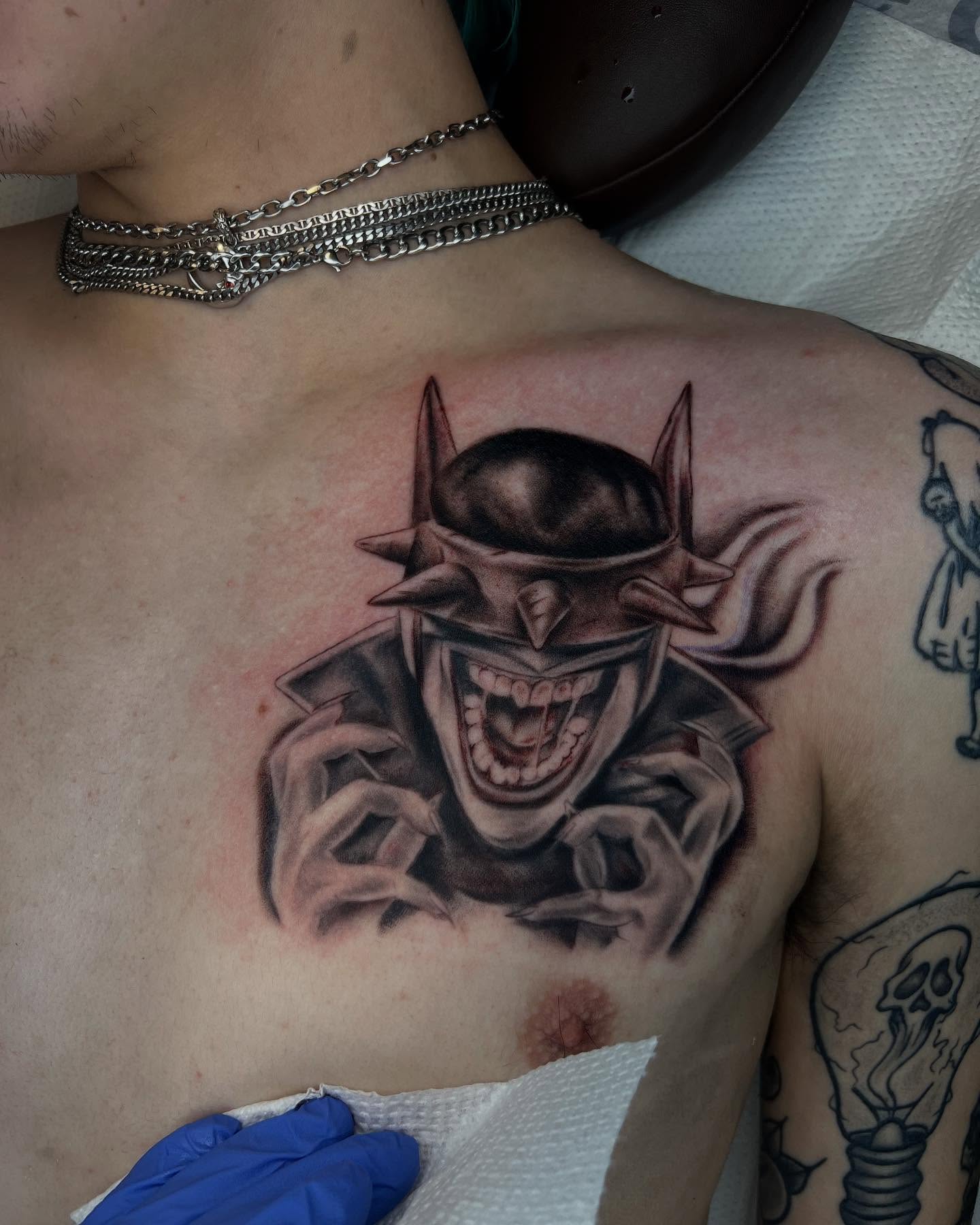 Joker dark realism tattoo on the chest by Kevyn Vidal