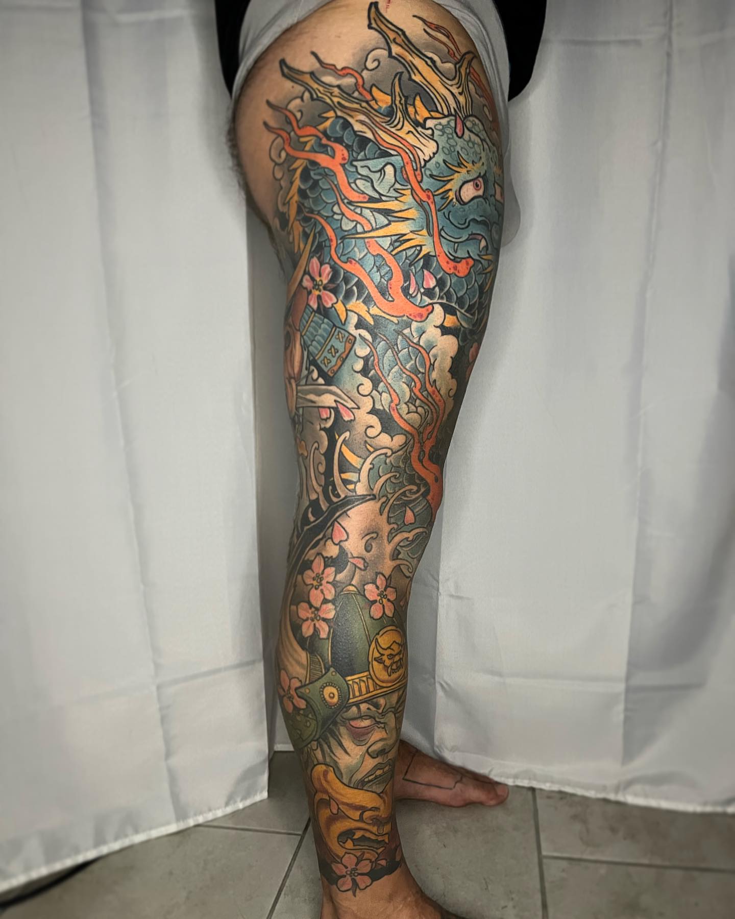 Dragon and flowers japanese irezumi tattoo on the calf by biggstattoos