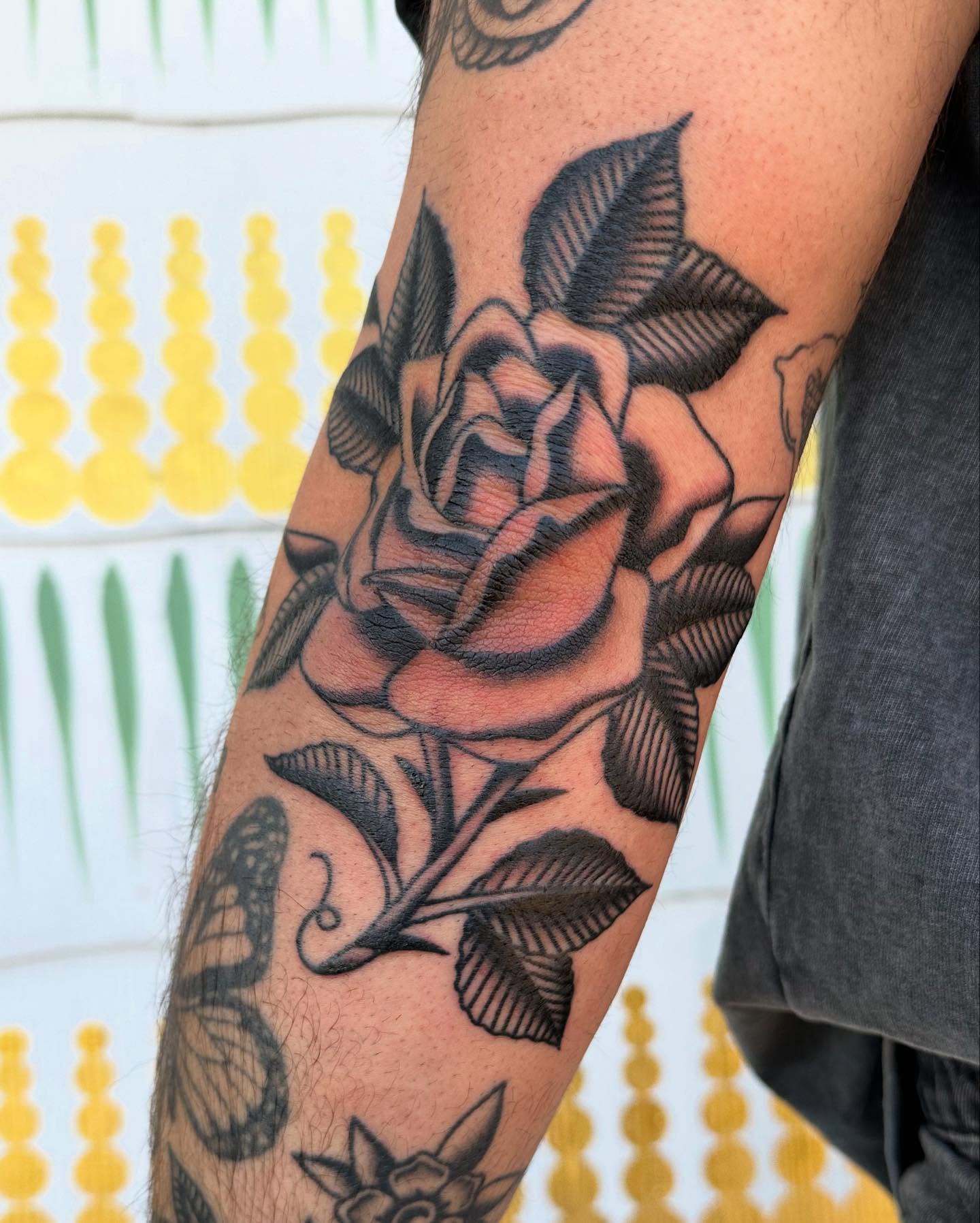 Rose American traditional tattoo on the forearm by Jess Ritchie, Austin, Texas