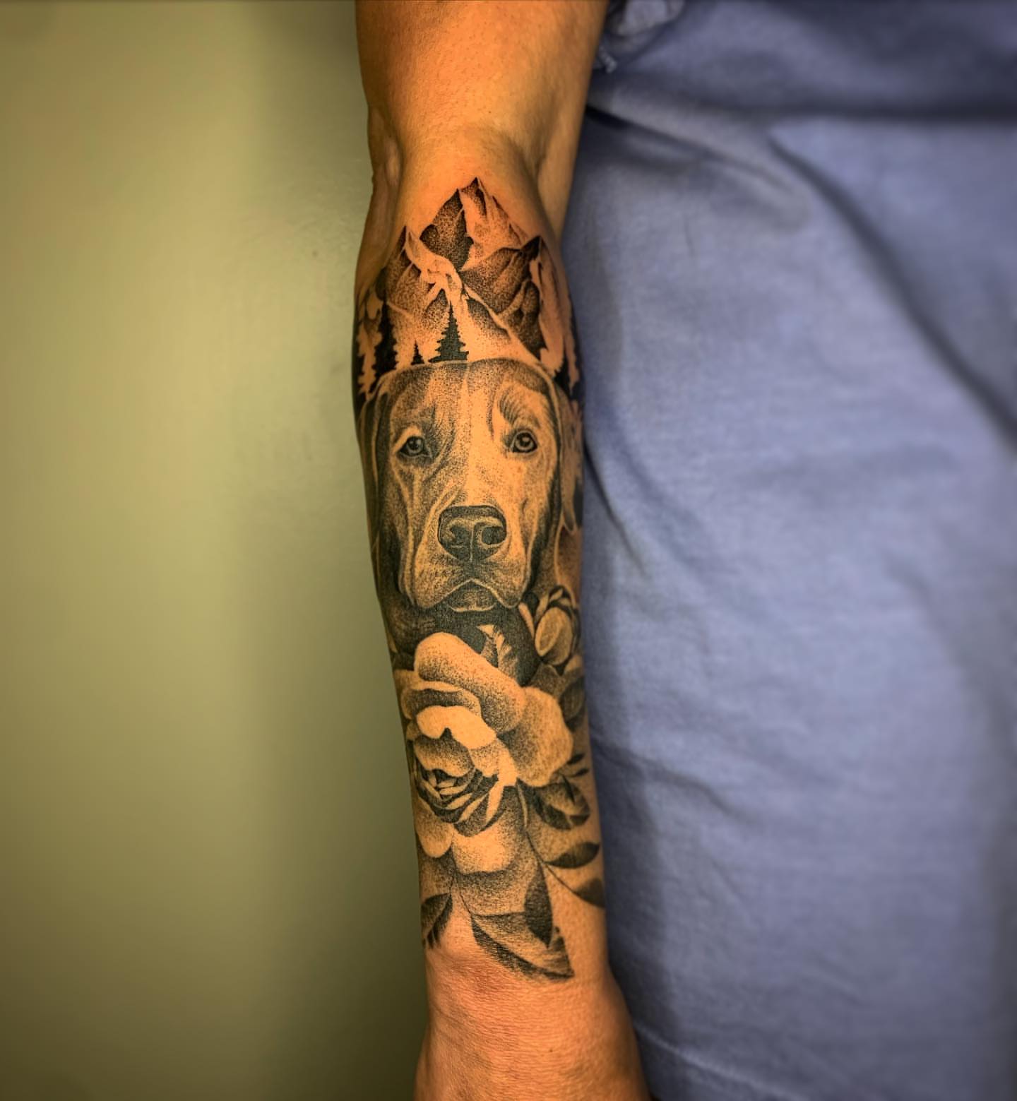 Dog and rose realism tattoo on the forearm by Jacob Deirfield, Circleville, Ohio