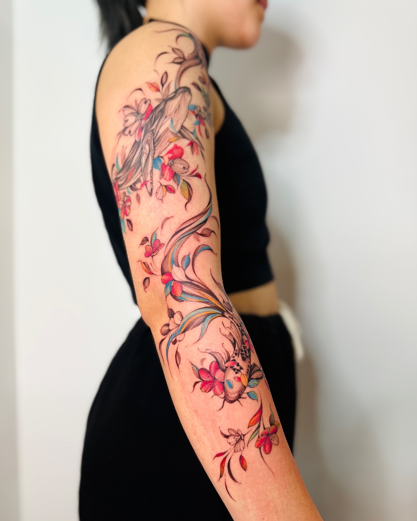 Bird and floral new school tattoo on the forearm by Dung Ngo