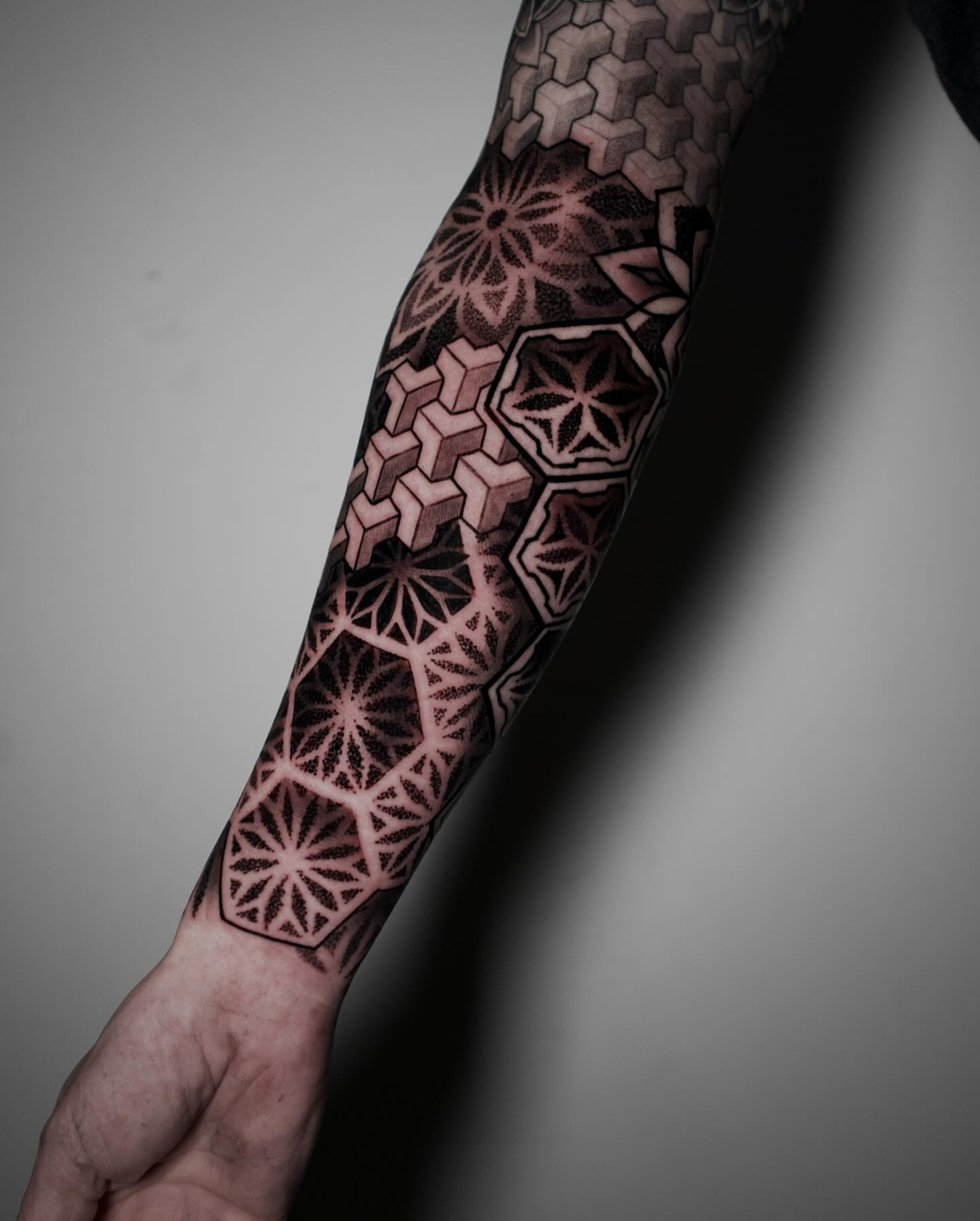 Geometric pattern geometric tattoo on the forearm by Eric Hare