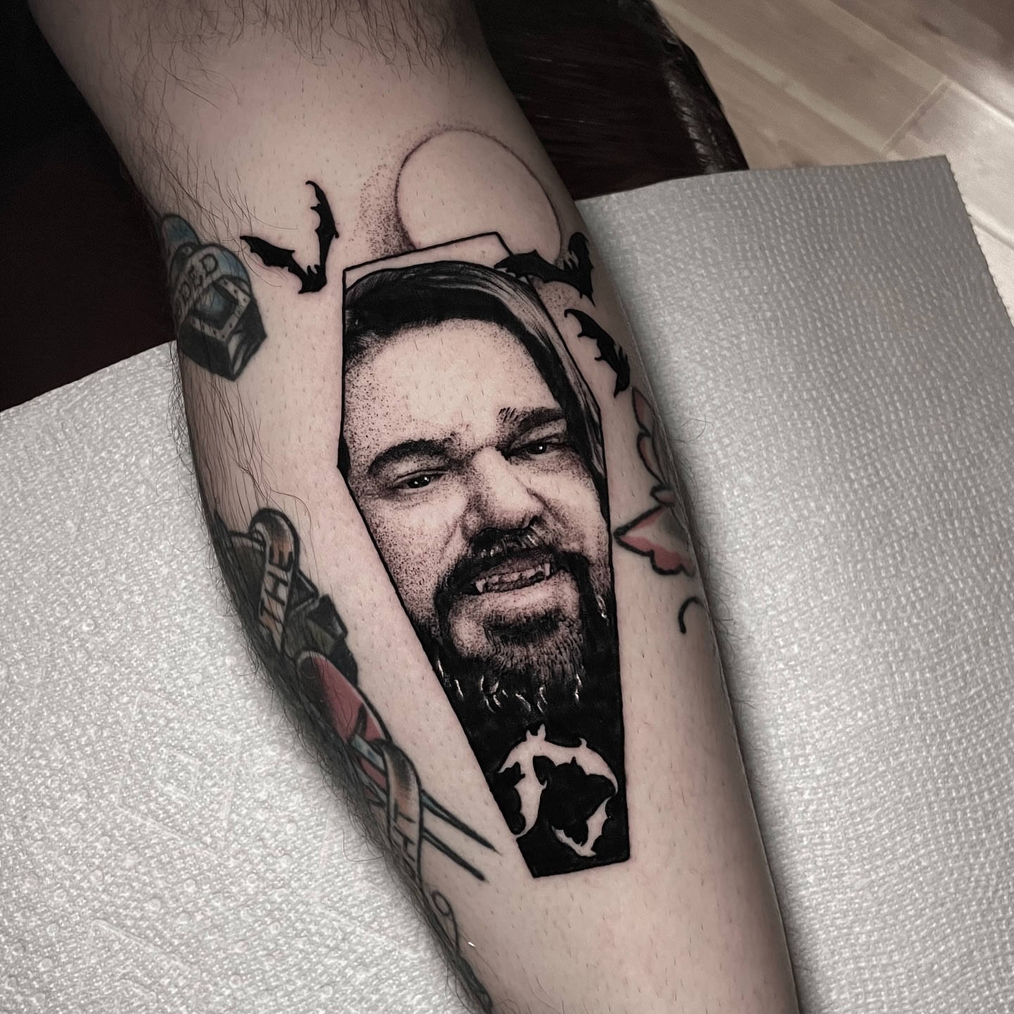 Portrait realism tattoo on the forearm by Ian Spong