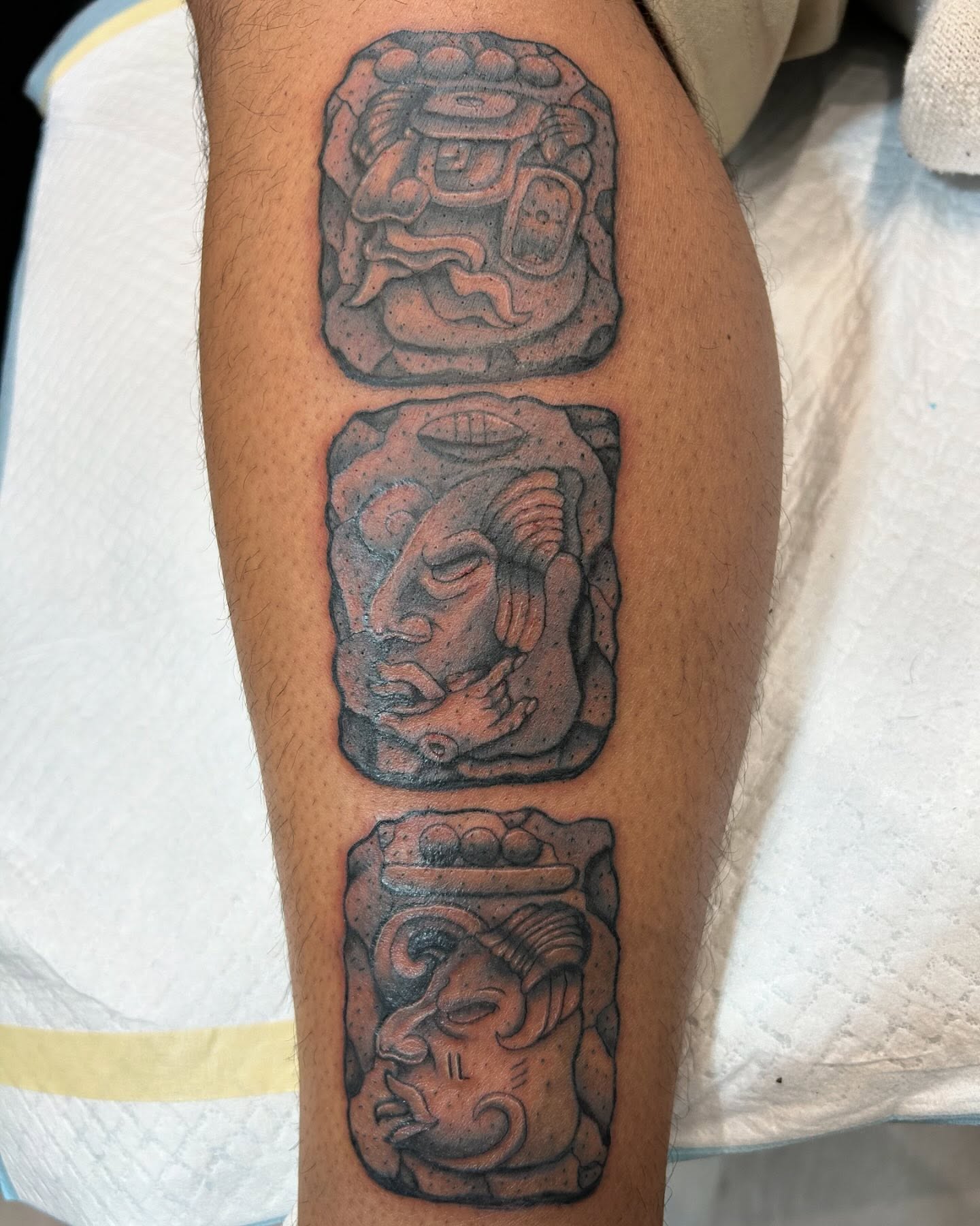 Ancient stone carving black and grey tattoo on the calf by 🇬🇹