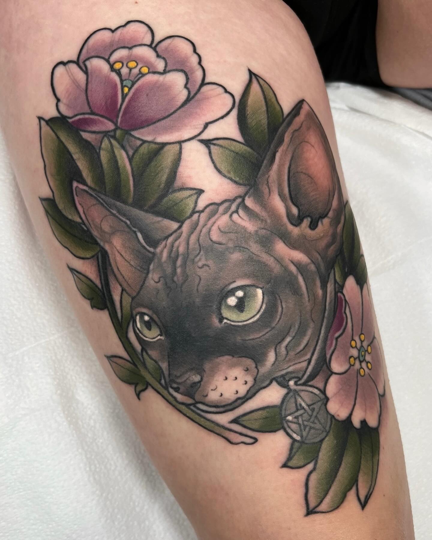 Cat with flowers realism tattoo on the thigh by Kyle Olson, Salt Lake City, Utah