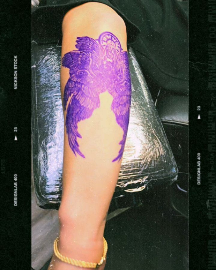 Angel wings neo-traditional tattoo on the forearm by André Brazil