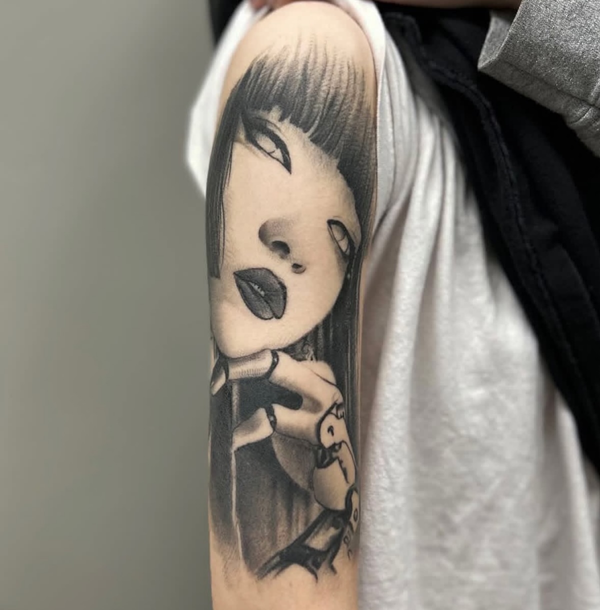 Anime character anime tattoo on the upper arm by Angel Pineda-Rodriguez