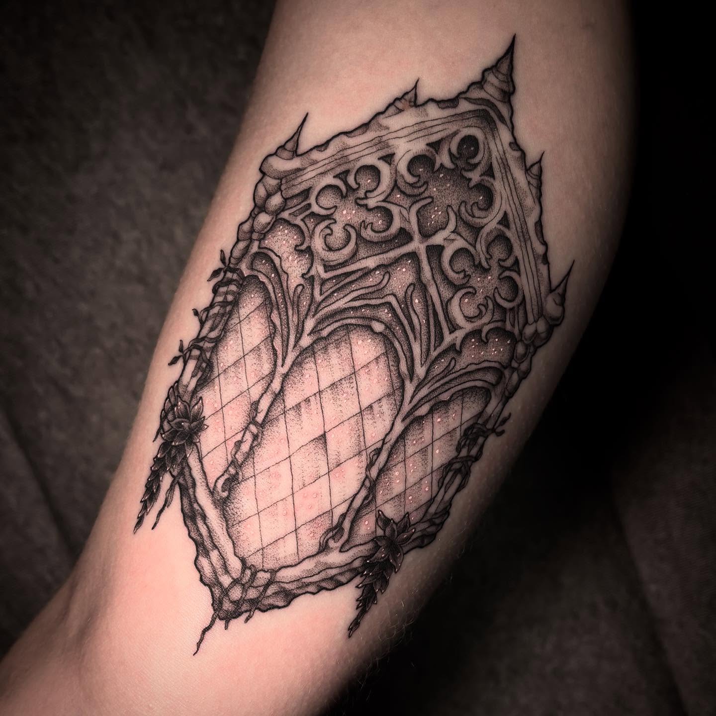 Ornamental heart dotwork tattoo on the forearm by Rachel Foster
