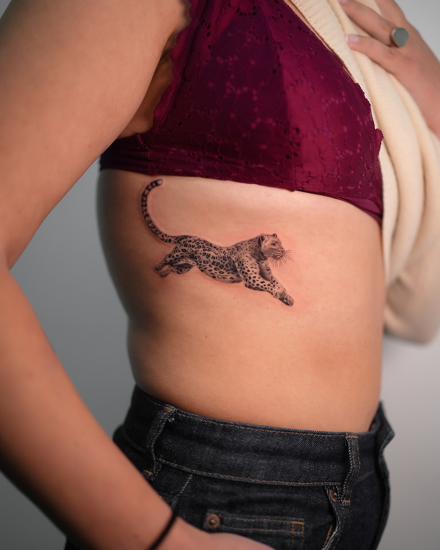 Leopard realism tattoo on the ribs by NYC