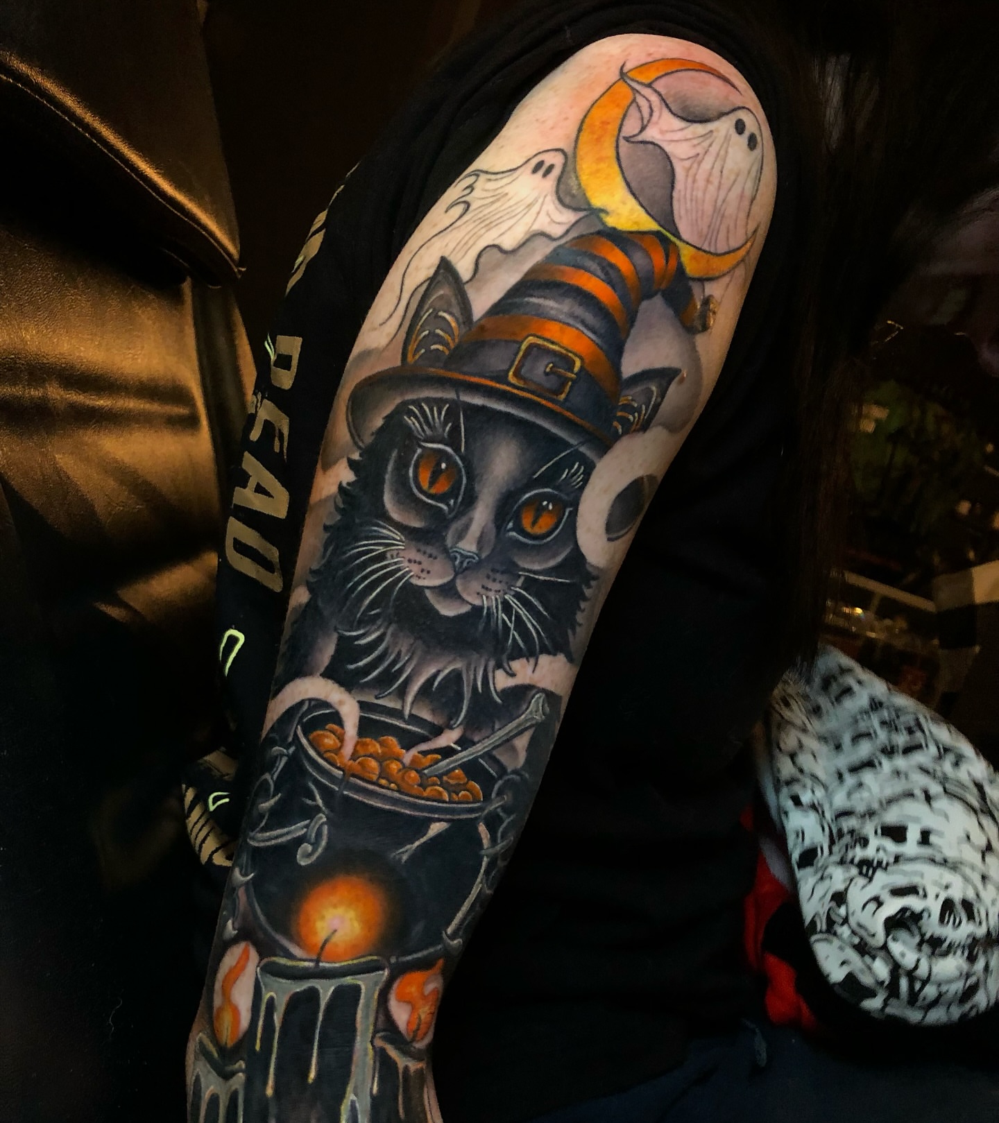 Cat with witch hat American traditional tattoo on the forearm by Melissa Brown