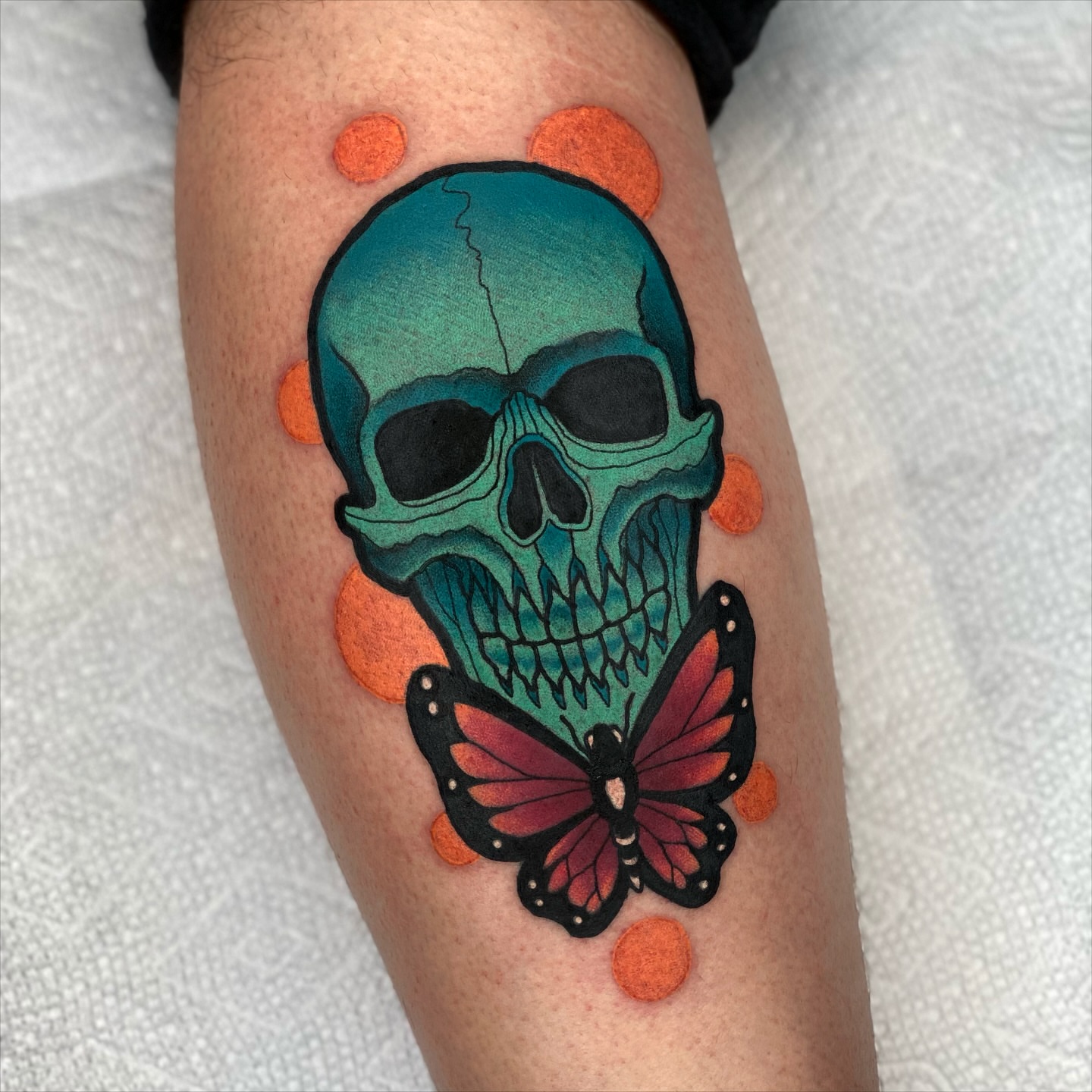 Skull and butterfly American traditional tattoo on the forearm by T Dubs ✏️